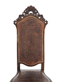 A Pair of Portuguese Carved Walnut and Tooled Leather Hall Chairs