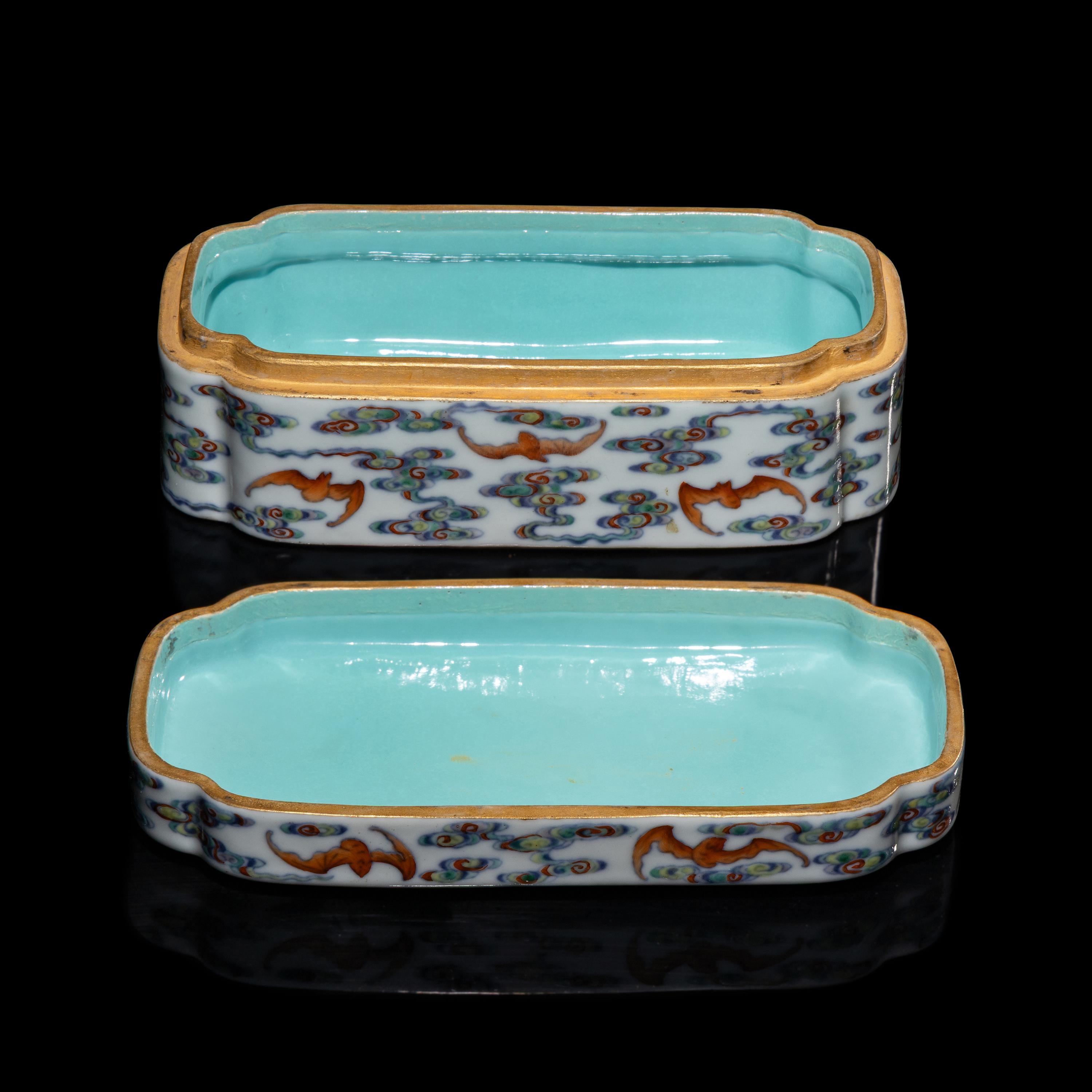 A Chinese Doucai Porcelain 'Bats and Clouds' Box and Cover, 18th Century — 清中期 斗彩五福捧壽長方盒