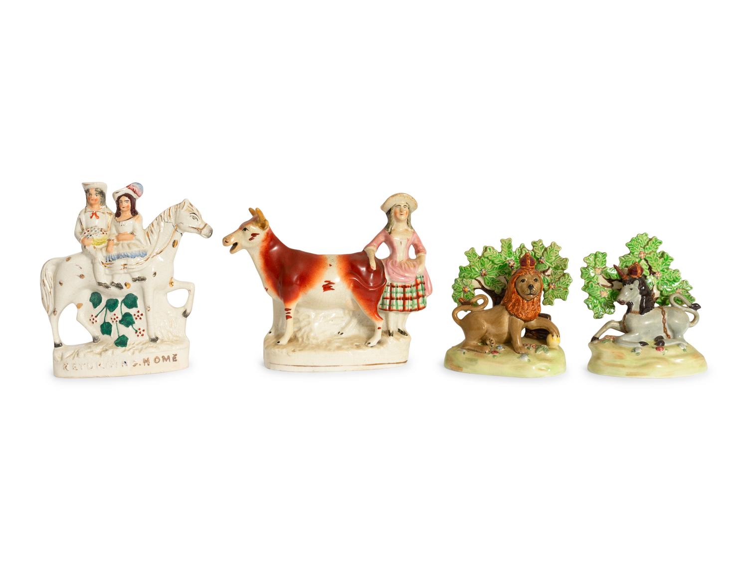 A Collection of Twelve Staffordshire Pottery Figures and Figural Wares