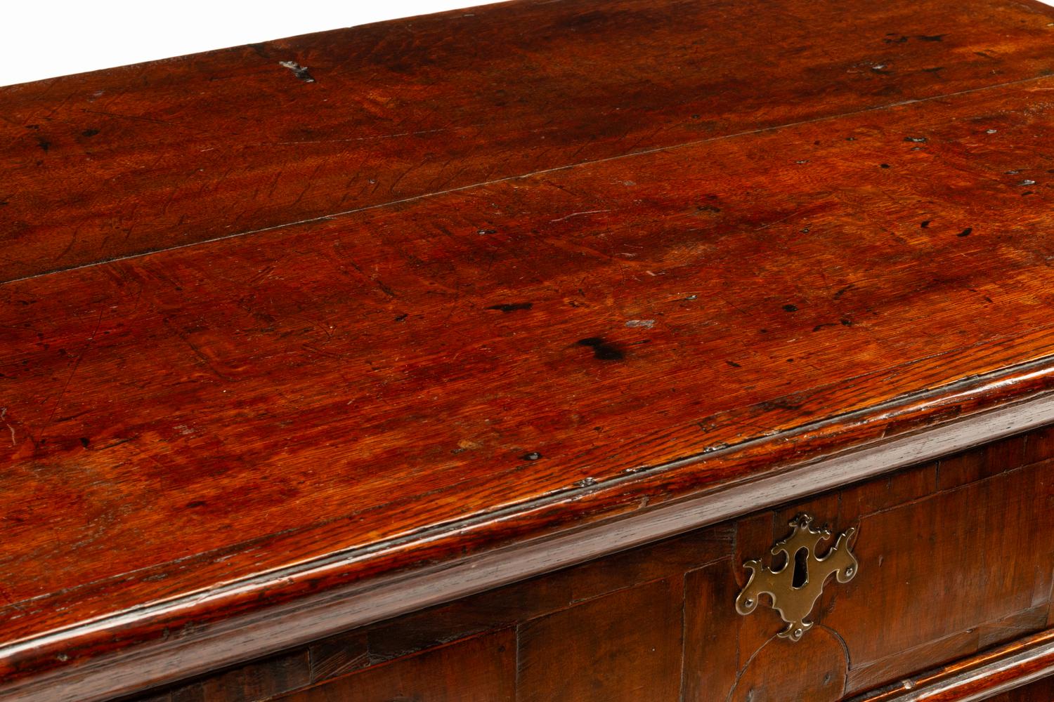 A George II Walnut and Oak Chest of Drawers