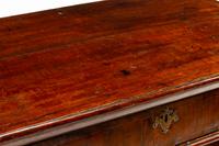 A George II Walnut and Oak Chest of Drawers