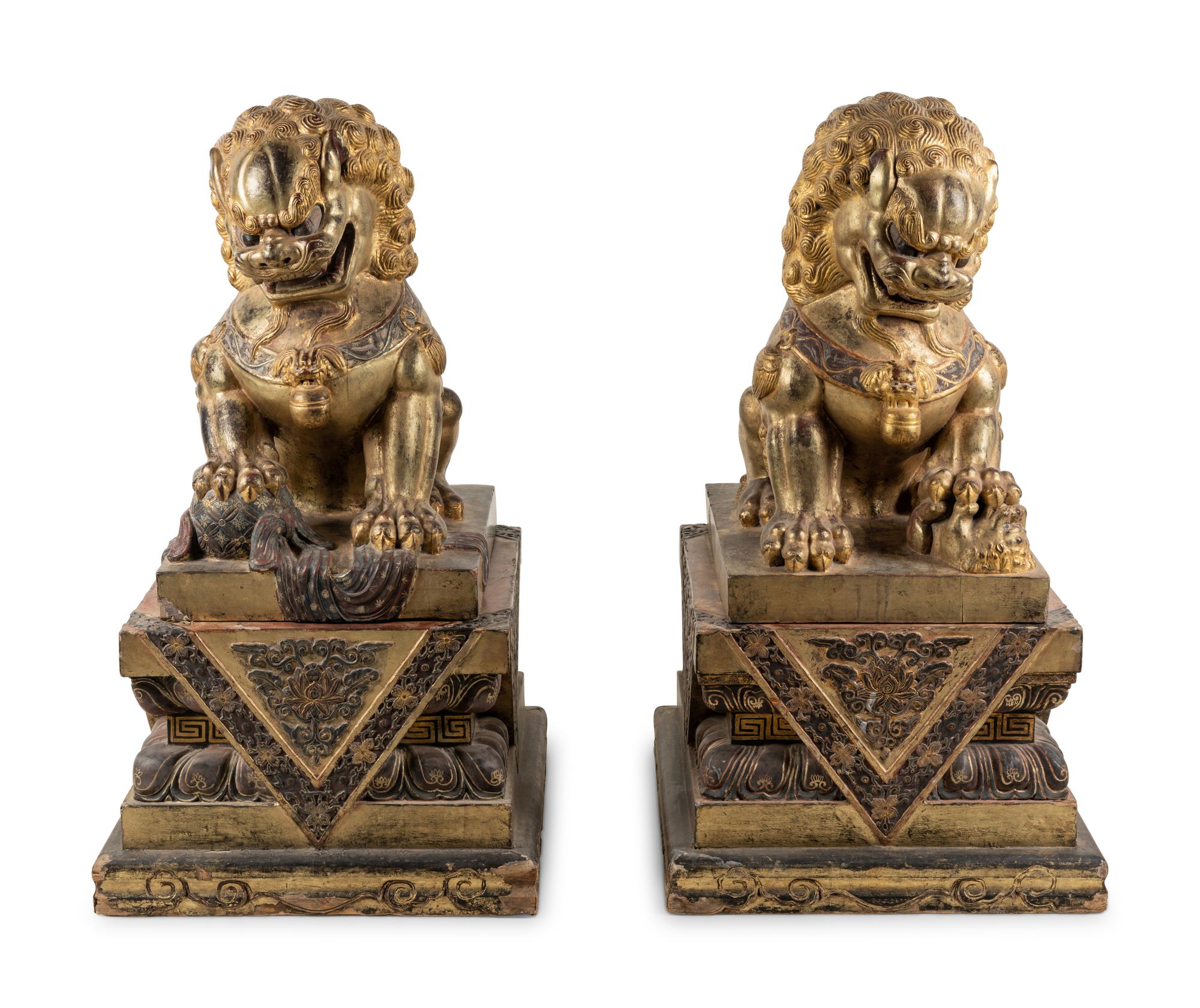 A Pair of Large Chinese Giltwood and Composition Buddhistic Lions