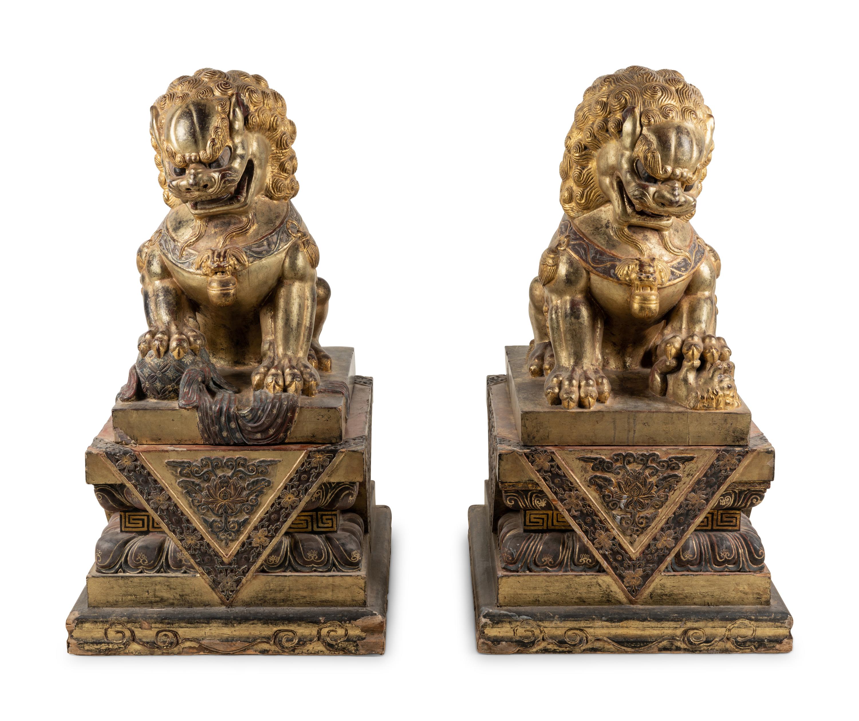 A Pair of Large Chinese Giltwood and Composition Buddhistic Lions