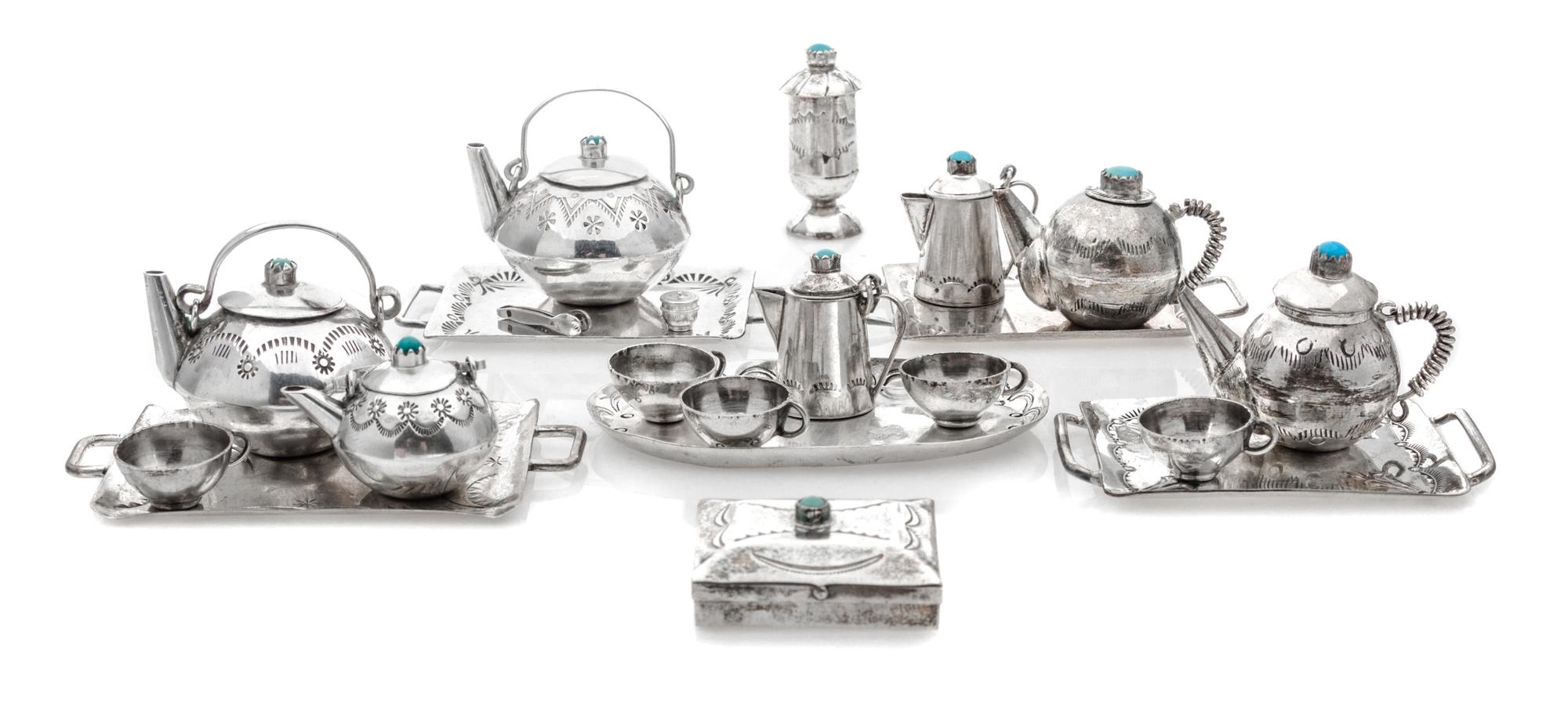 A Collection of Native American Silver Table Articles, Various Makers, comprising five trays, five cups, two pairs of teapots, a pair o