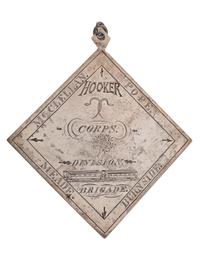 [CIVIL WAR]. III Corps badge identified to Sergeant Charles F. Browne, Company F, 1st Massachusetts Regiment, WIA Fredericksburg, Chancellorsville, and Gettysburg.