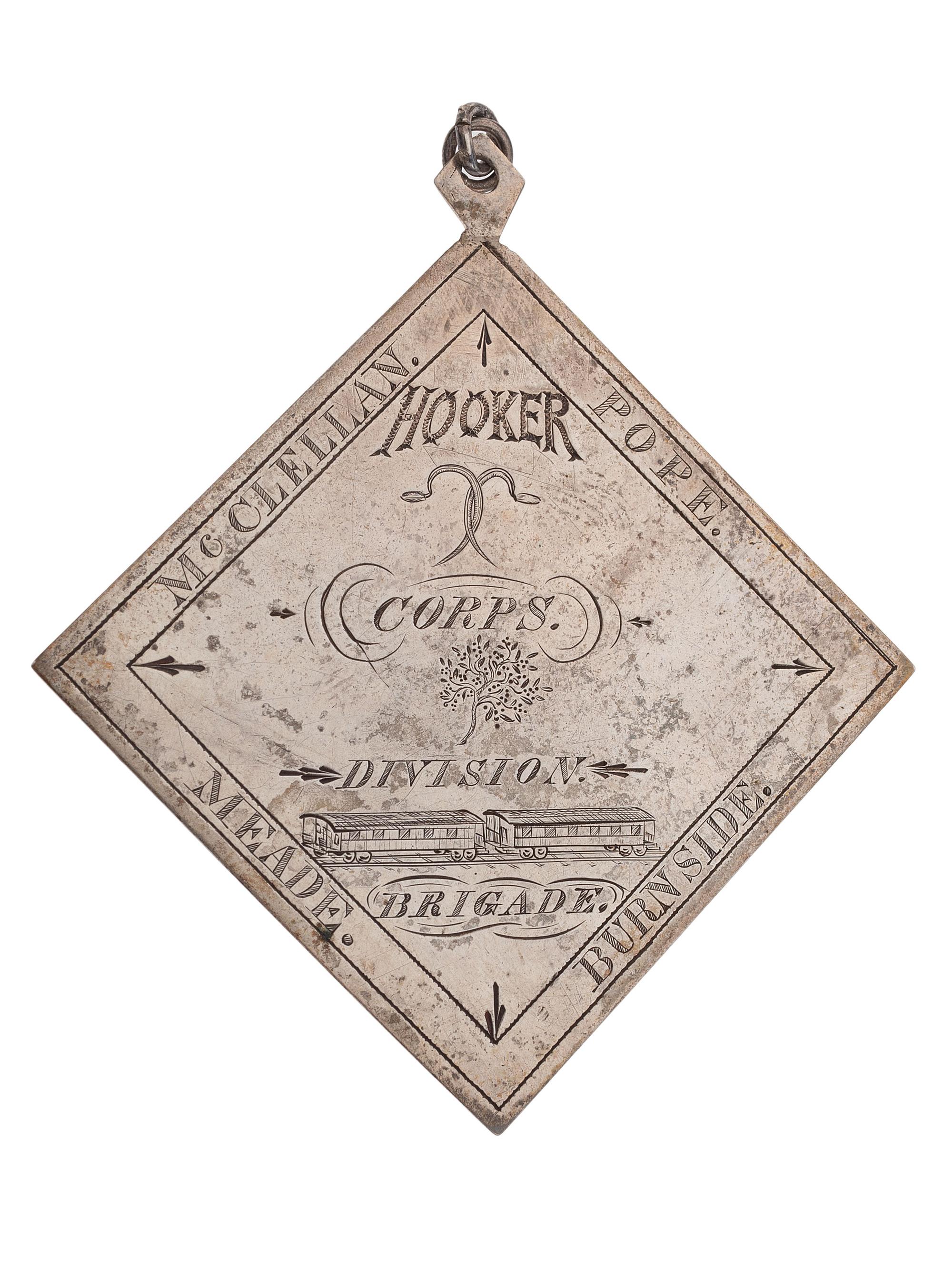 [CIVIL WAR]. III Corps badge identified to Sergeant Charles F. Browne, Company F, 1st Massachusetts Regiment, WIA Fredericksburg, Chancellorsville, and Gettysburg.
