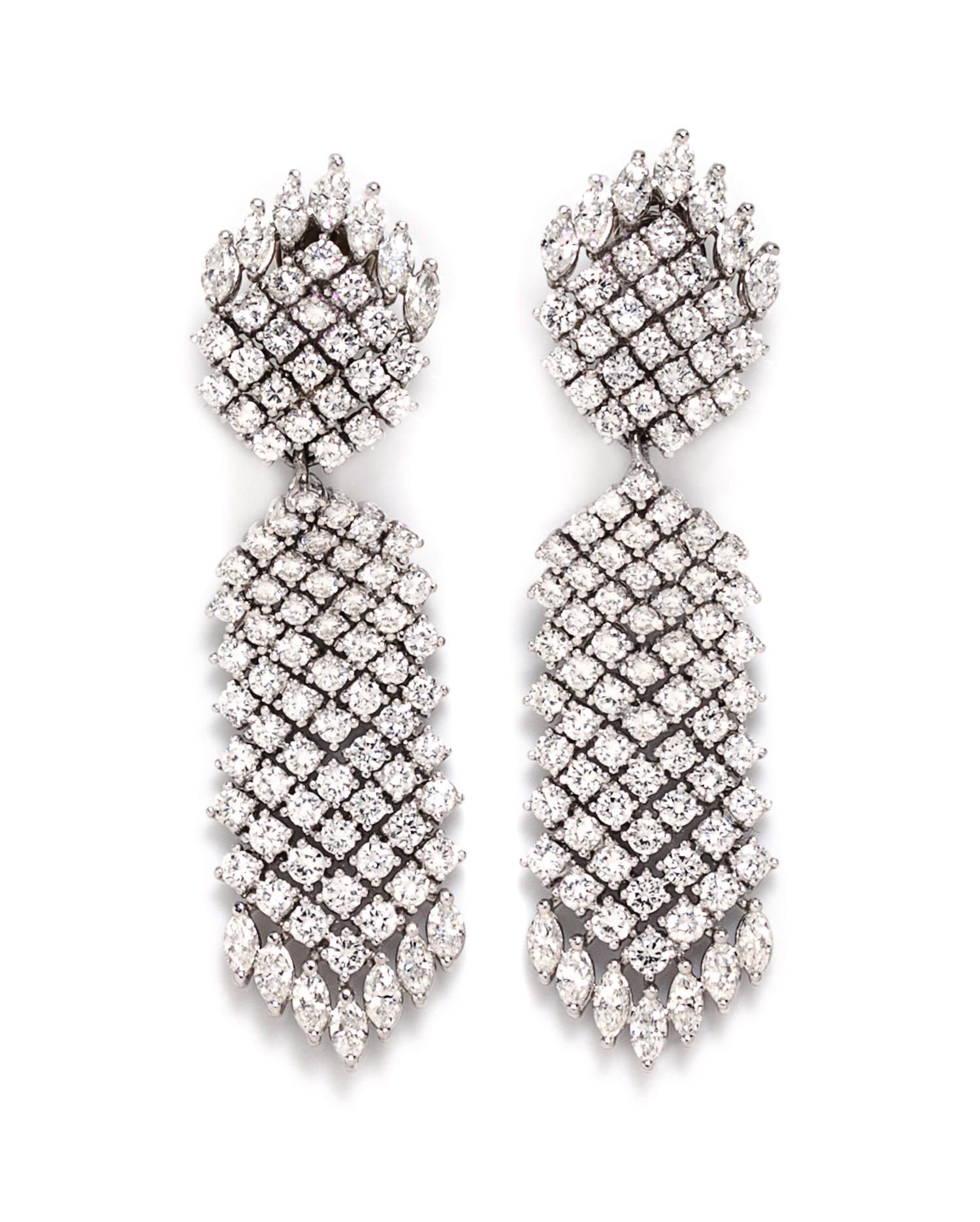 A Pair Of Platinum and Diamond Convertible Earclips, Tilson, 37.30 dwts.