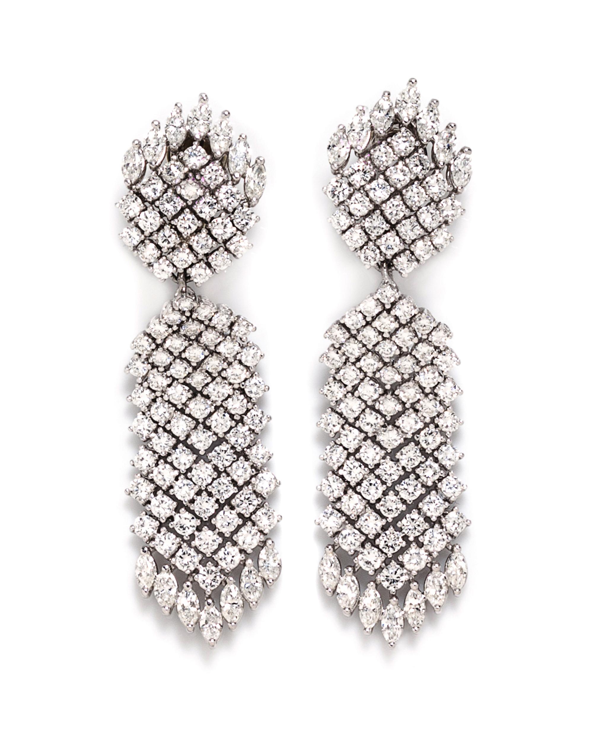 A Pair Of Platinum and Diamond Convertible Earclips, Tilson, 37.30 dwts.