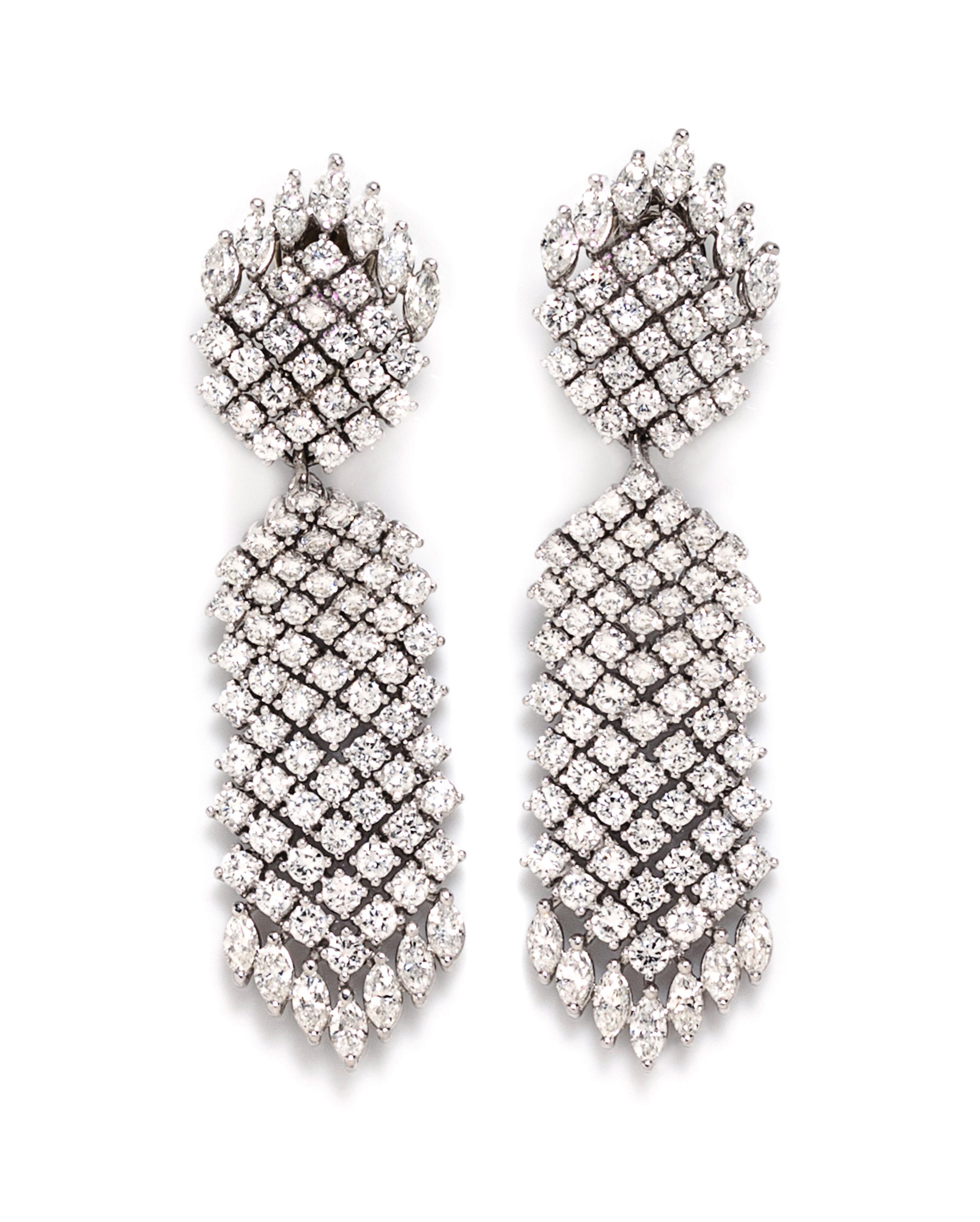 A Pair Of Platinum and Diamond Convertible Earclips, Tilson, 37.30 dwts.