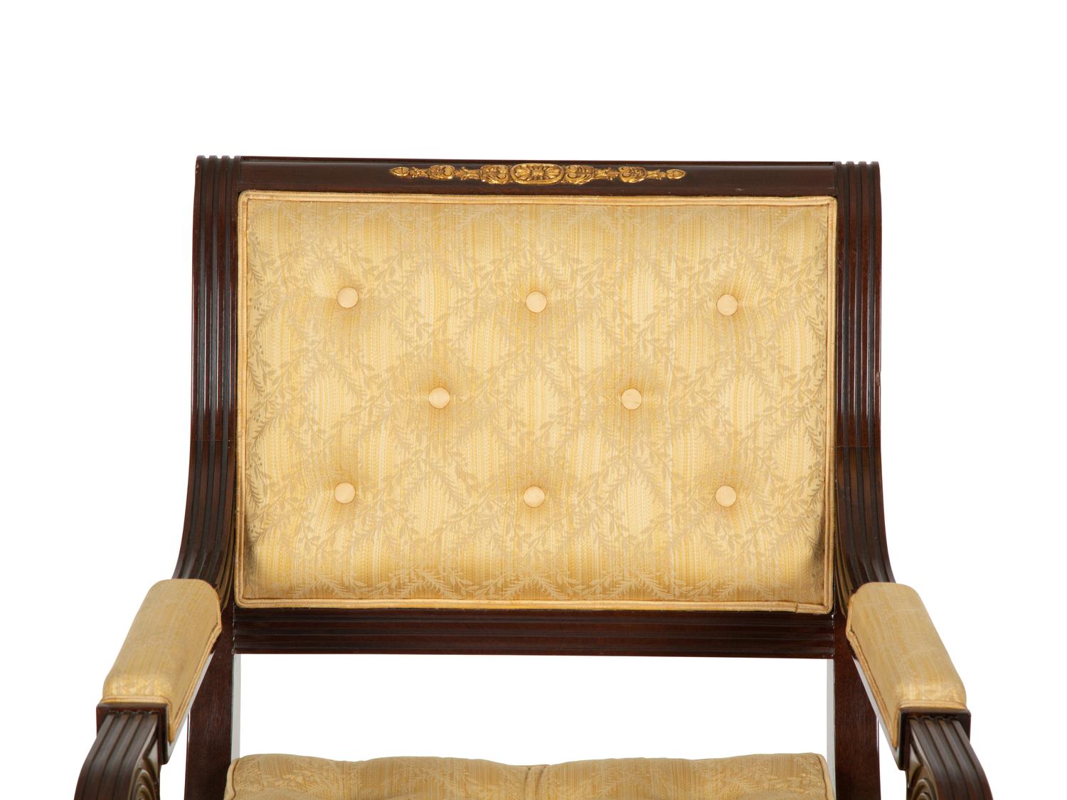 A French Empire Style Mahogany and Parcel Gilt Fauteuil