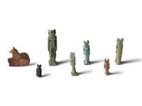 Seven Egyptian Faience and Stone Anubis Amulets