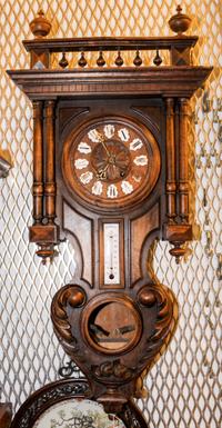 A French Walnut Wall Clock. Height overall 36 inches.