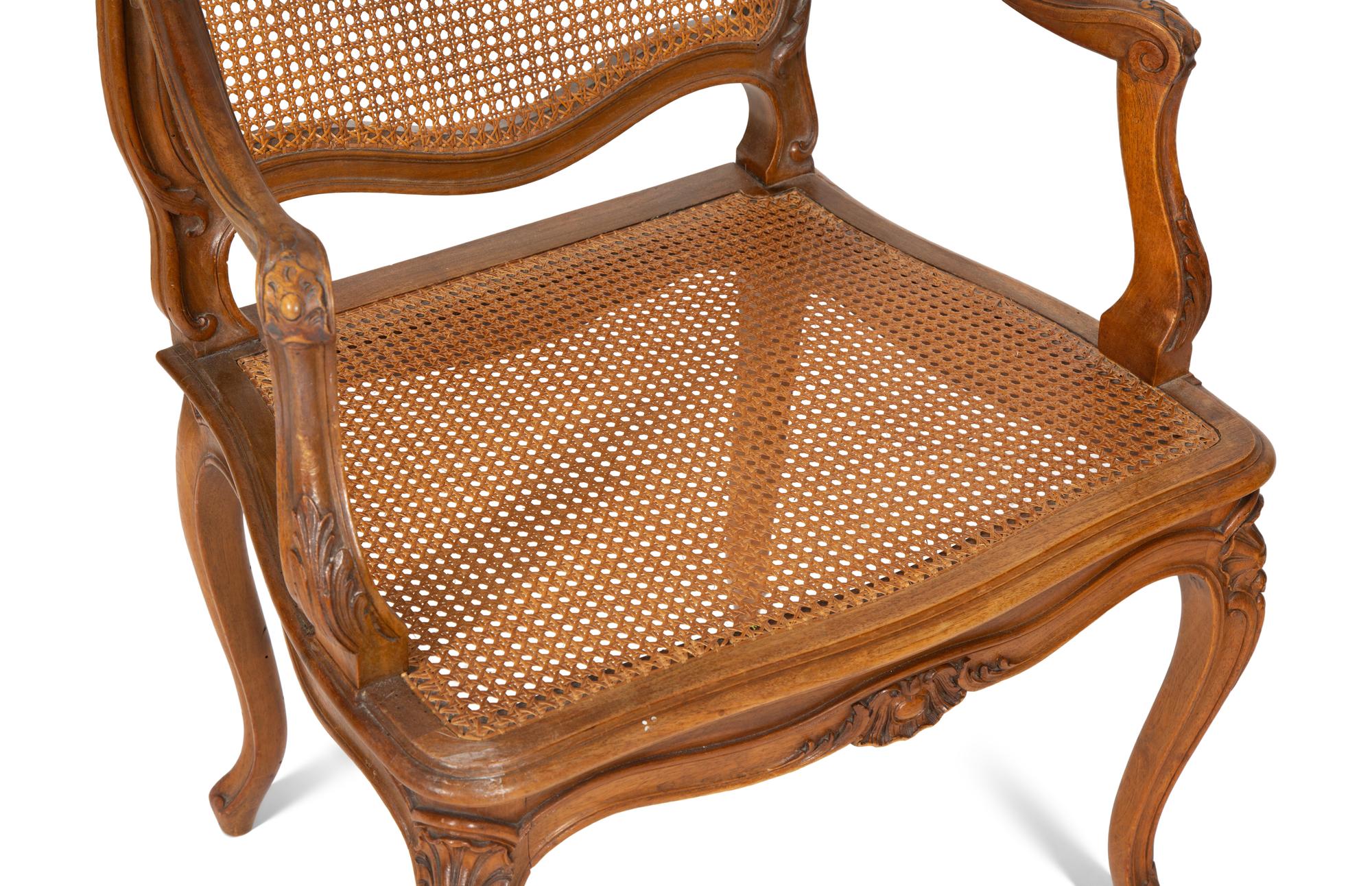 A Pair of Louis XV Style Caned Beechwood Fauteuils