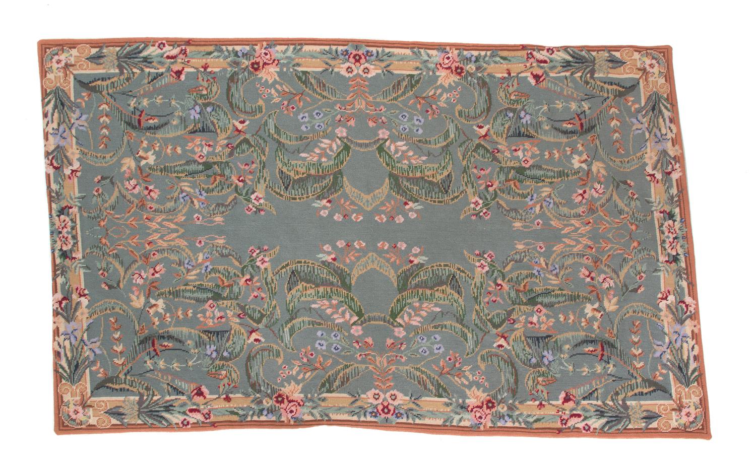 A Needlework Rug 57 1/2 x 37 inches. — 20TH CENTURY