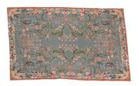 A Needlework Rug 57 1/2 x 37 inches. — 20TH CENTURY