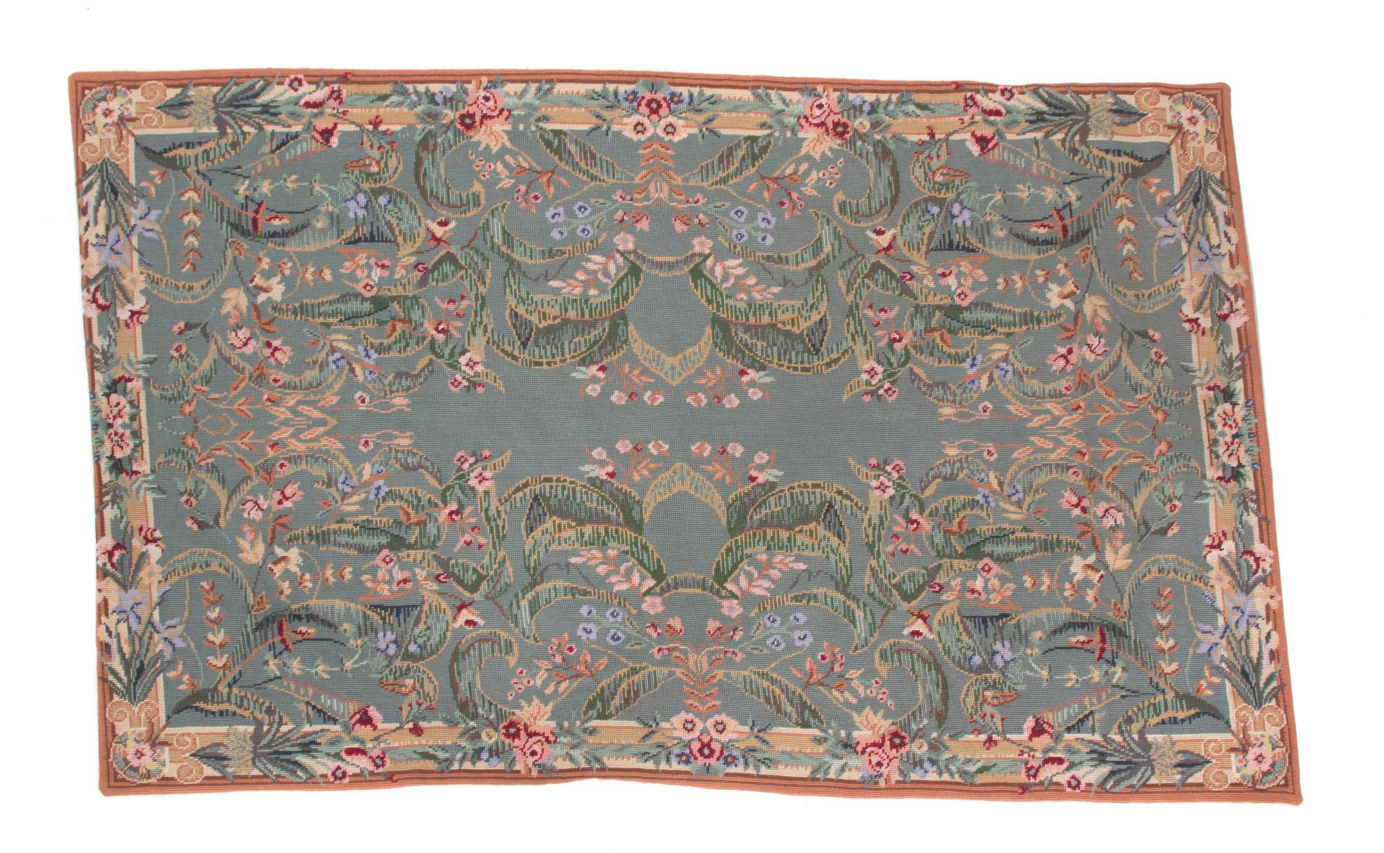 A Needlework Rug 57 1/2 x 37 inches. — 20TH CENTURY