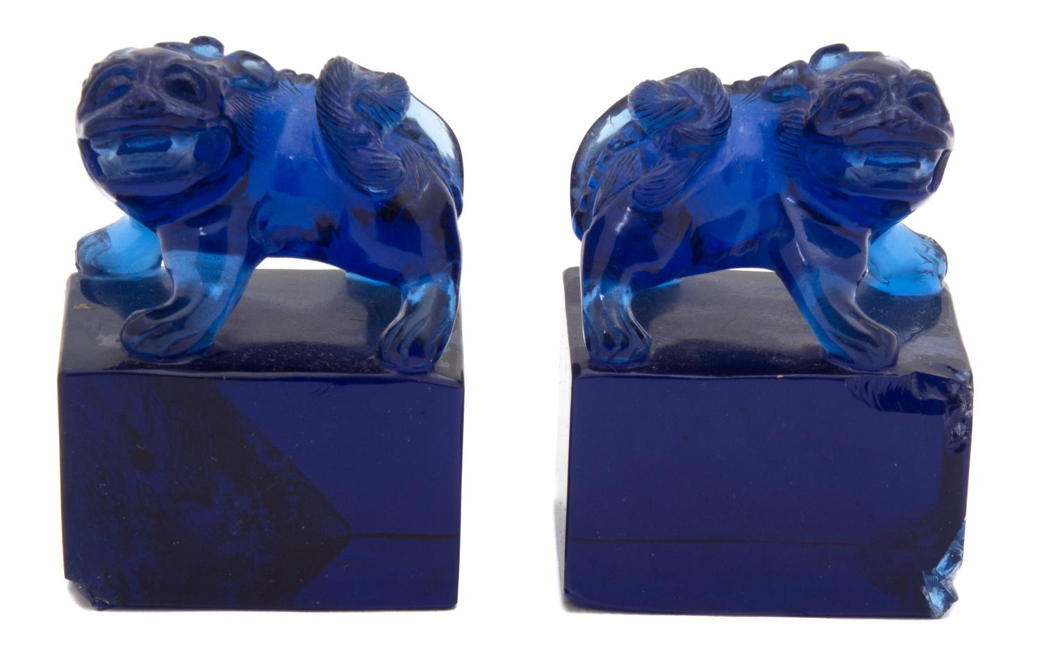 A Pair of Chinese Blue Peking Glass Foo Lions Height of lion 3 inches. — 19TH CENTURY