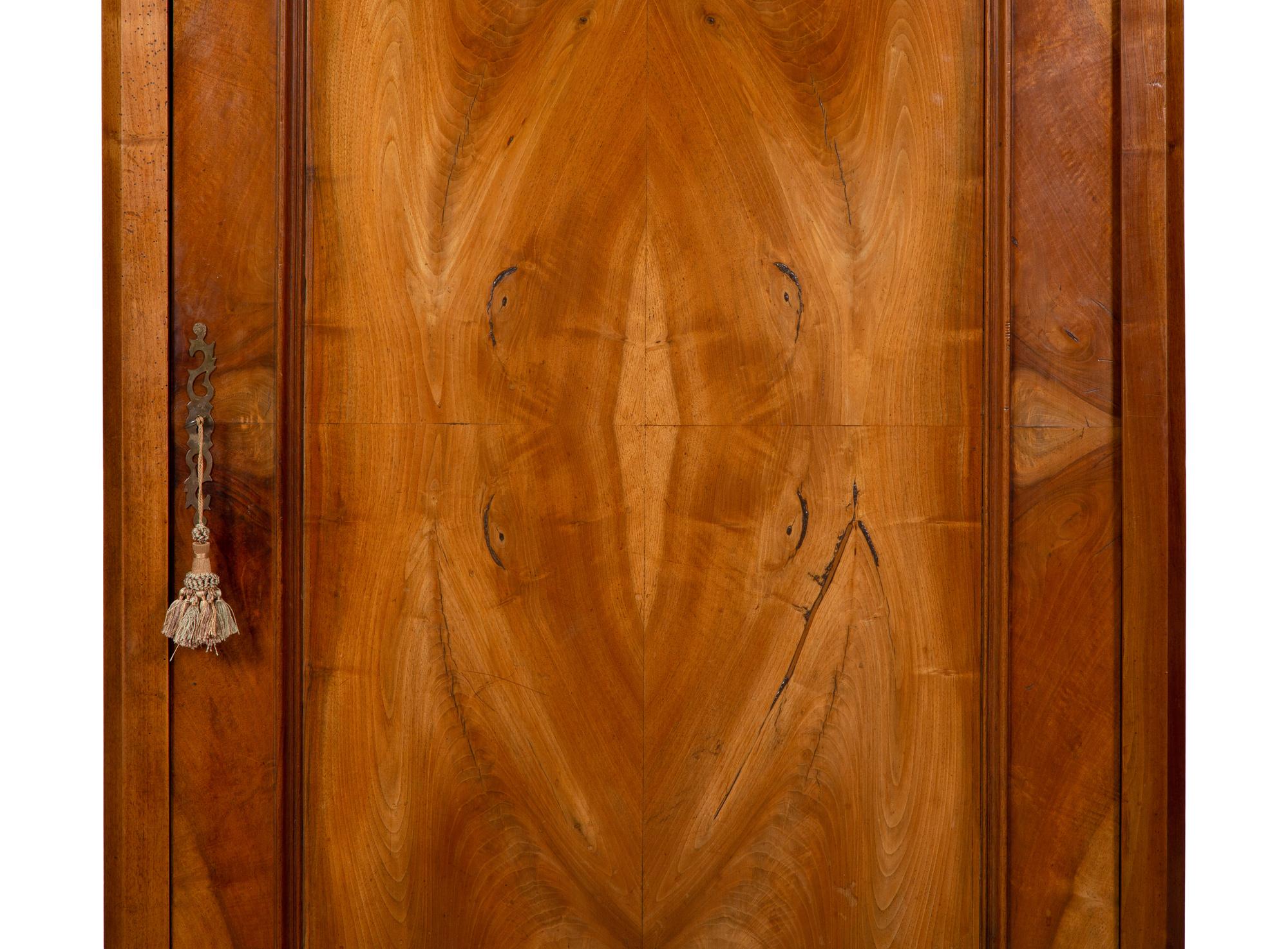An Italian Figured Walnut Wardrobe Cabinet