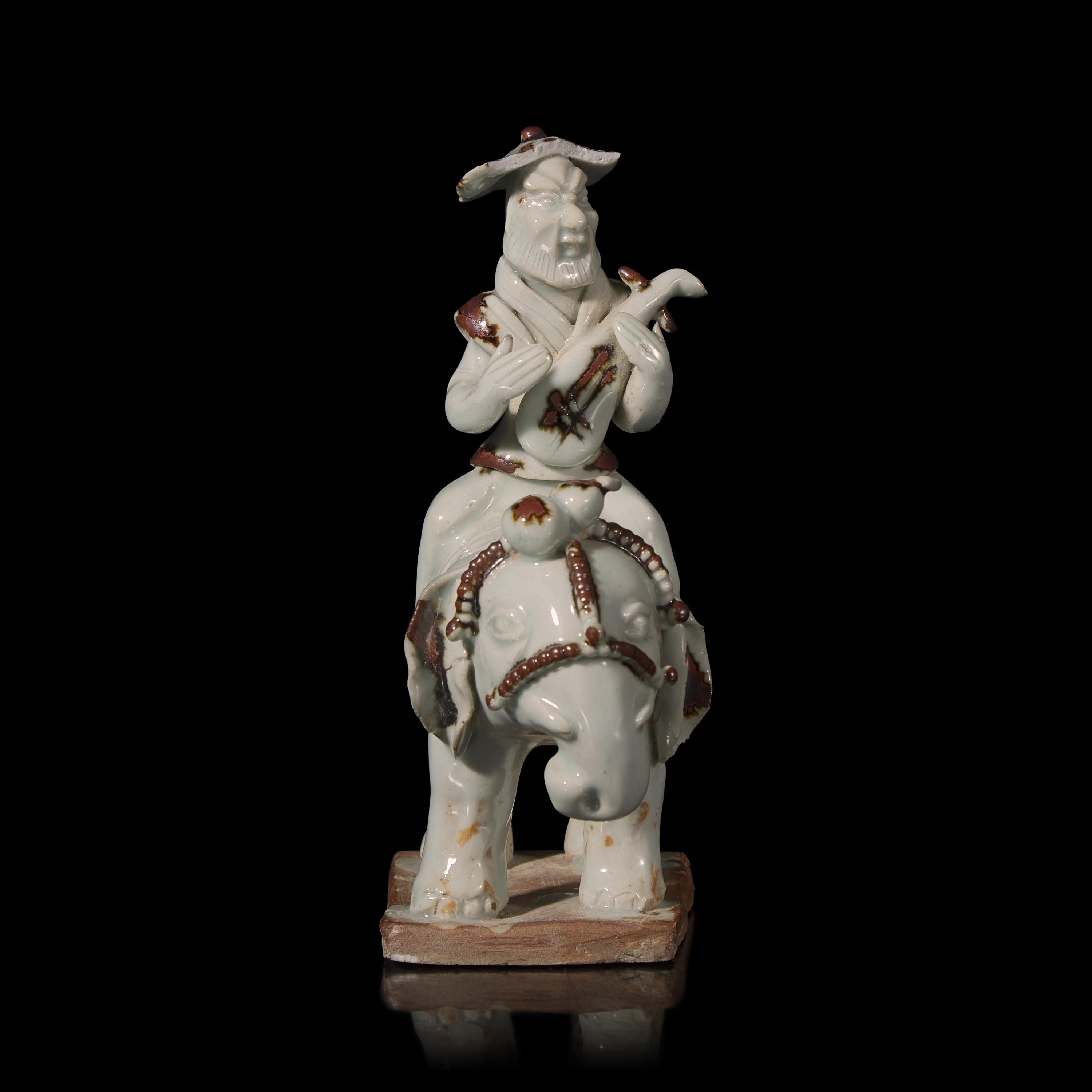 A Chinese Hutian Spotted Qingbai Glazed Porcelain Foreign Musicians Riding an Elephant — 湖田窯青白釉胡人琵琶騎象俑