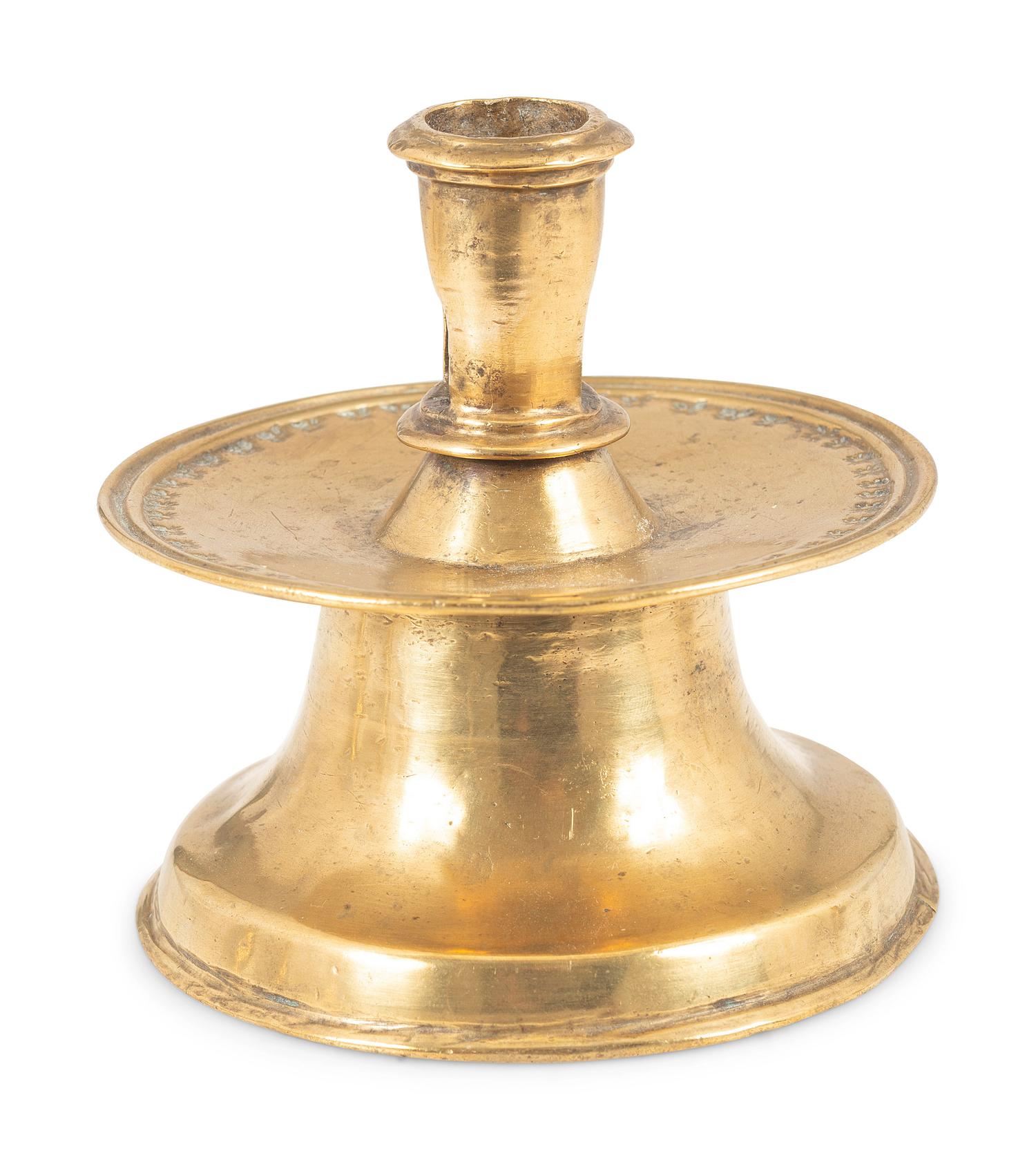 A Continental Punched Brass Capstan Candlestick