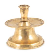 A Continental Punched Brass Capstan Candlestick