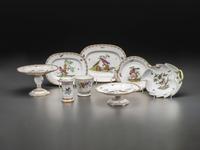 An English Parcel Gilt Bird and Insect Decorated Porcelain Partial Dinner Service