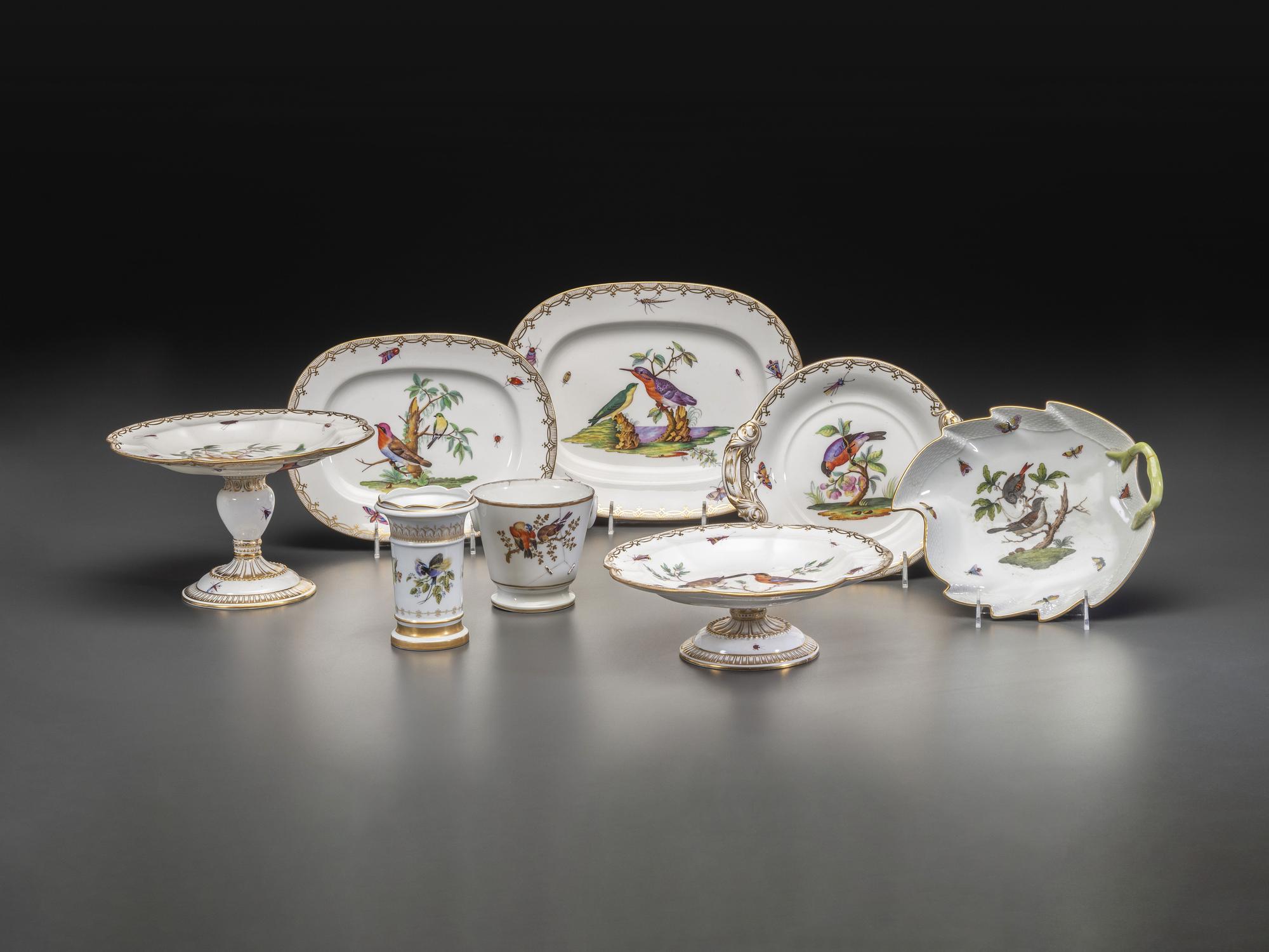 An English Parcel Gilt Bird and Insect Decorated Porcelain Partial Dinner Service