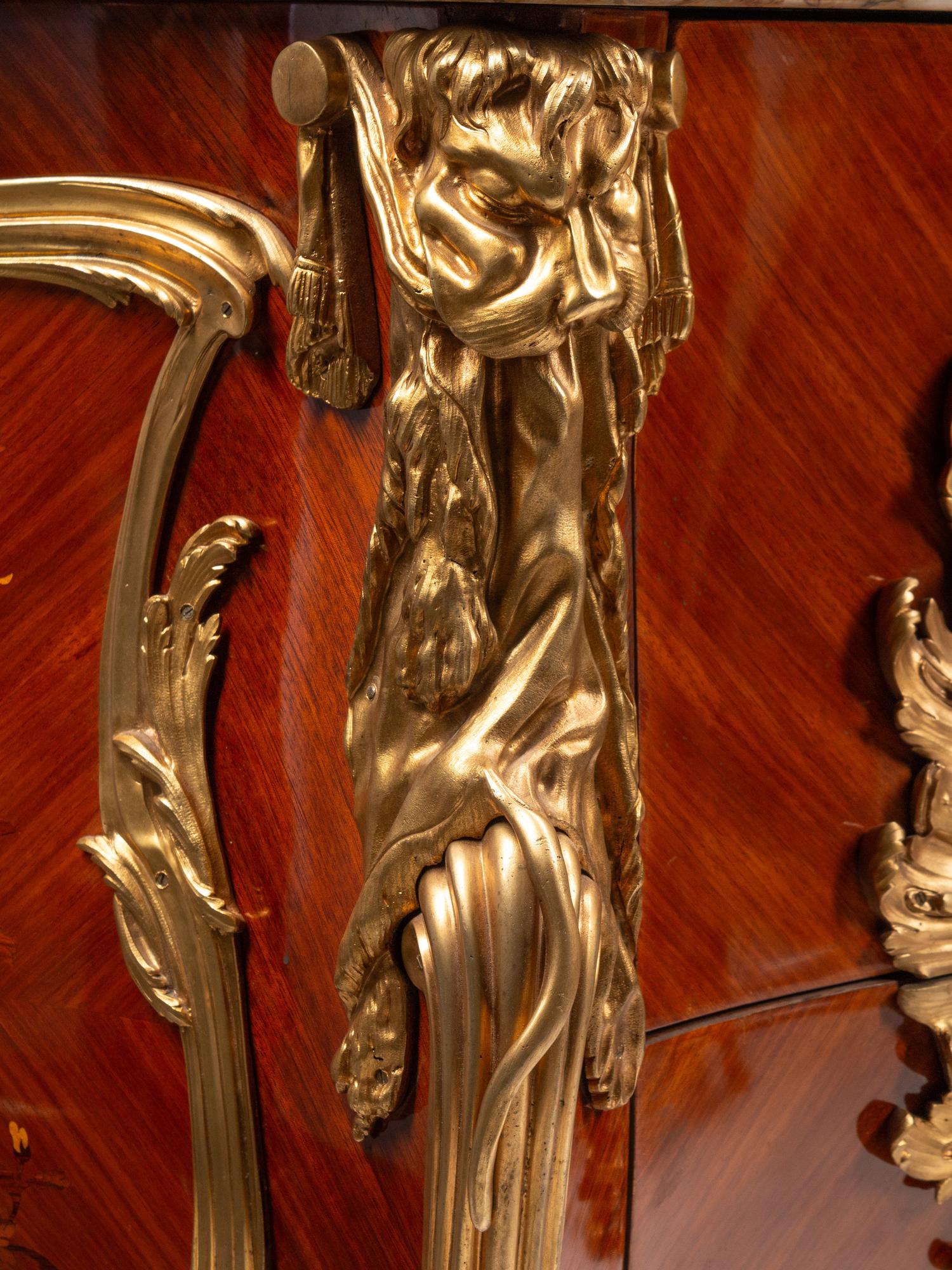 A Pair of Louis XV Style Gilt Bronze Mounted Kingwood and Floral Marquetry Marble-Top Commodes