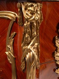 A Pair of Louis XV Style Gilt Bronze Mounted Kingwood and Floral Marquetry Marble-Top Commodes
