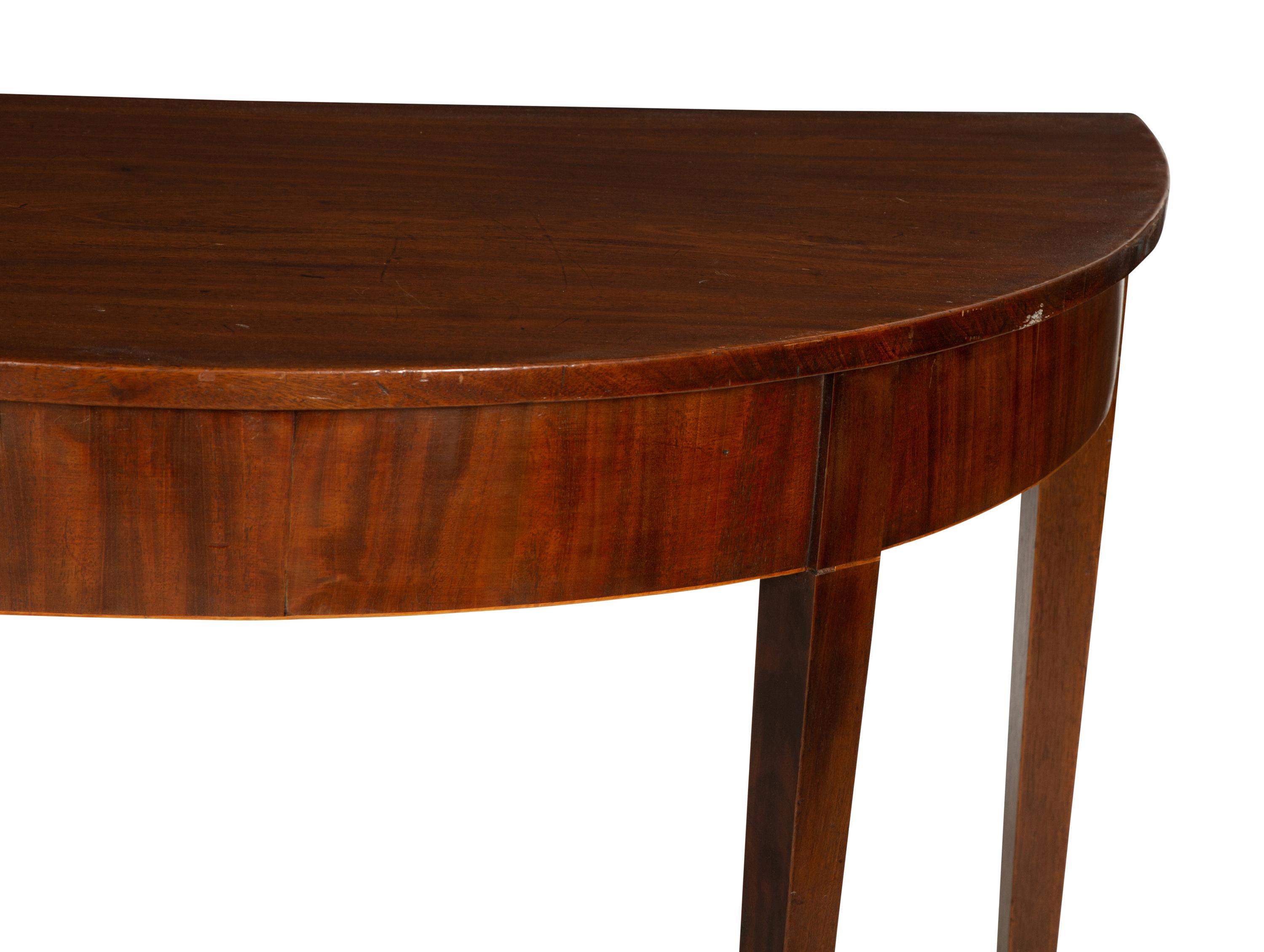 A Pair of George III Mahogany Demilune Console Tables