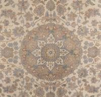 An Ivory and Pastel Rug
