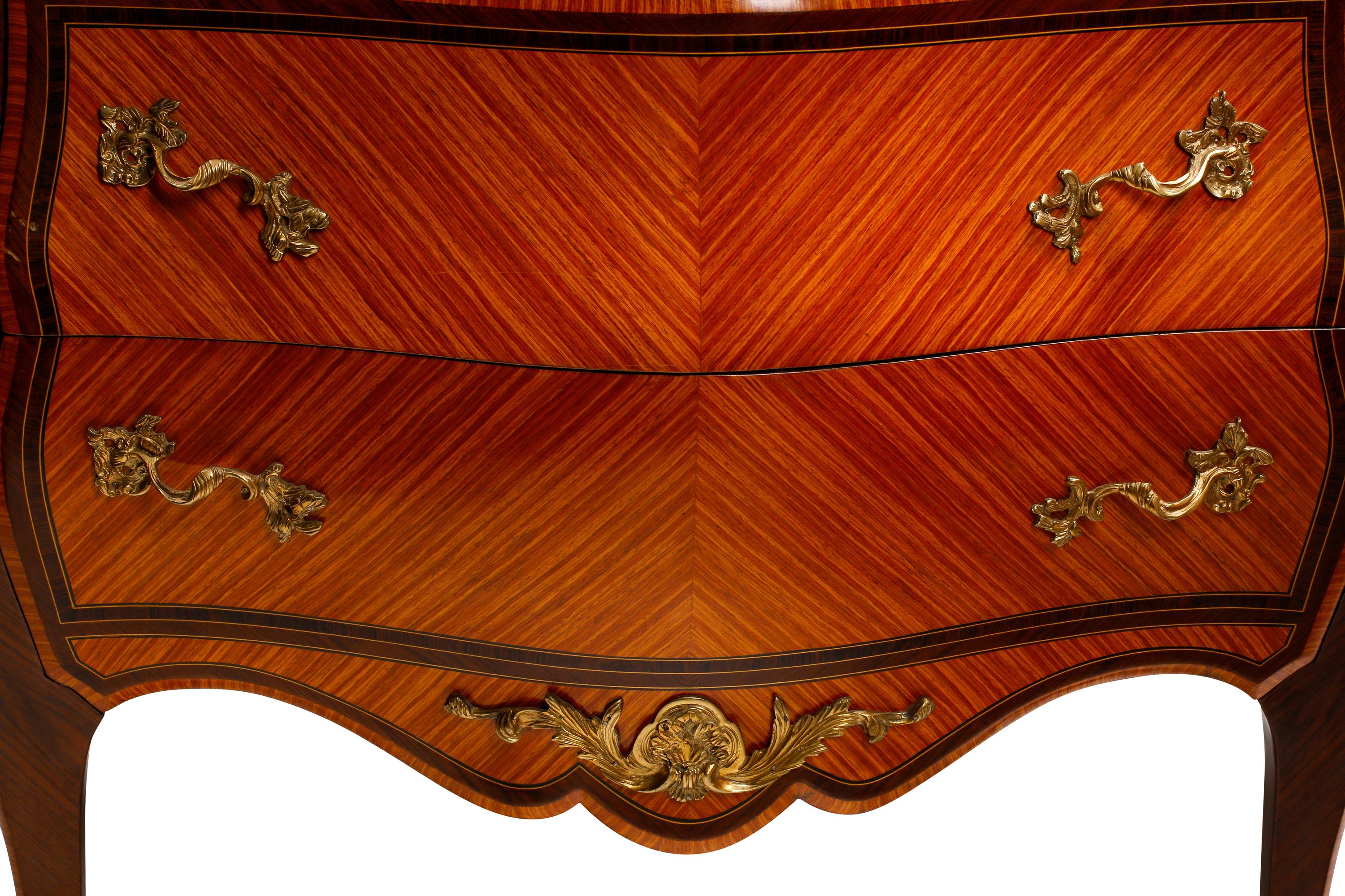 A Pair of Louis XV Style Bookmatch Veneered and Gilt Bronze Mounted Marble-Top Commodes