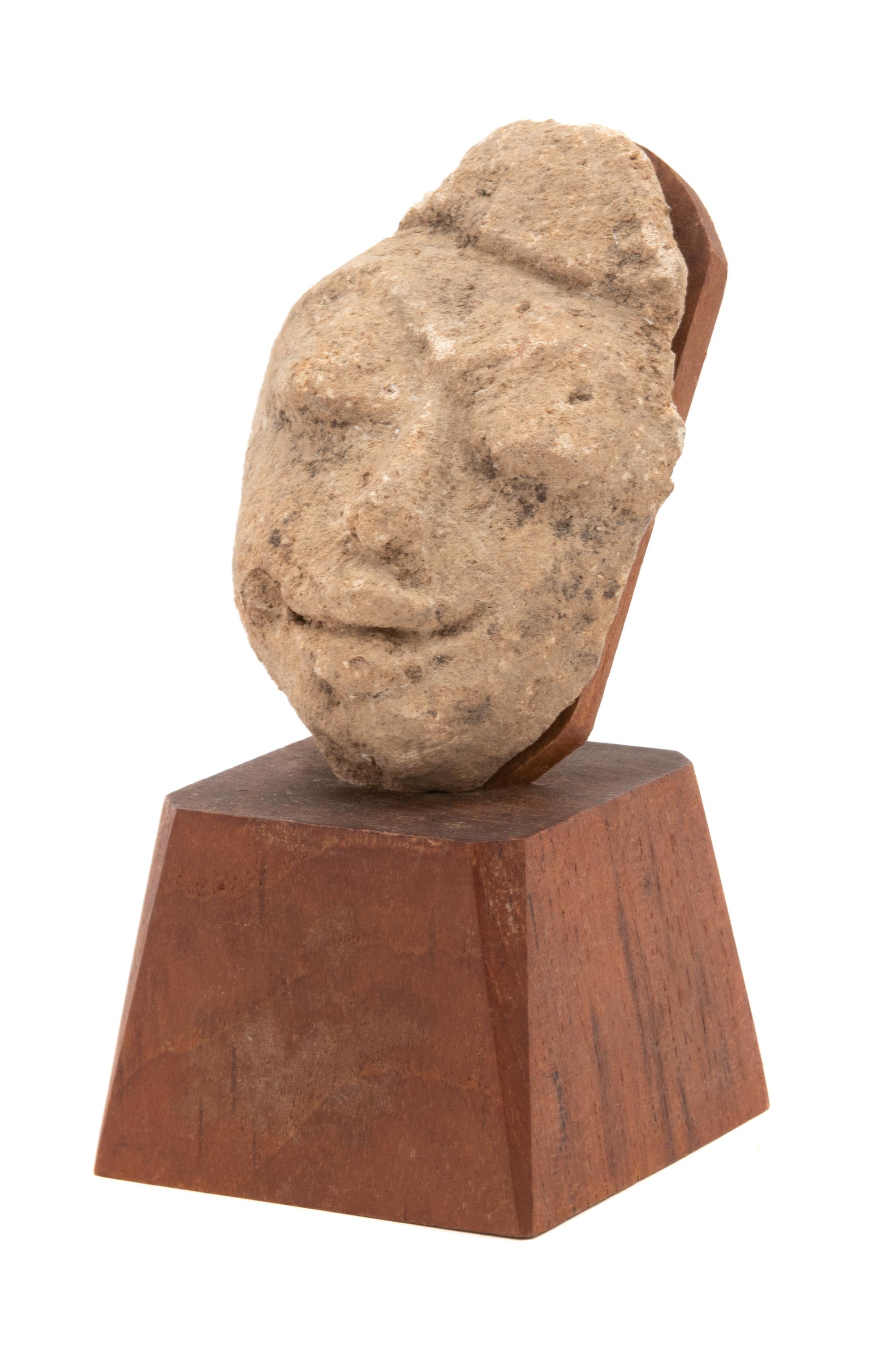 A Thai Stucco Face Fragment Height 4 inches. — MON-DVARAVATI STYLE, 8TH/9TH CENTURY
