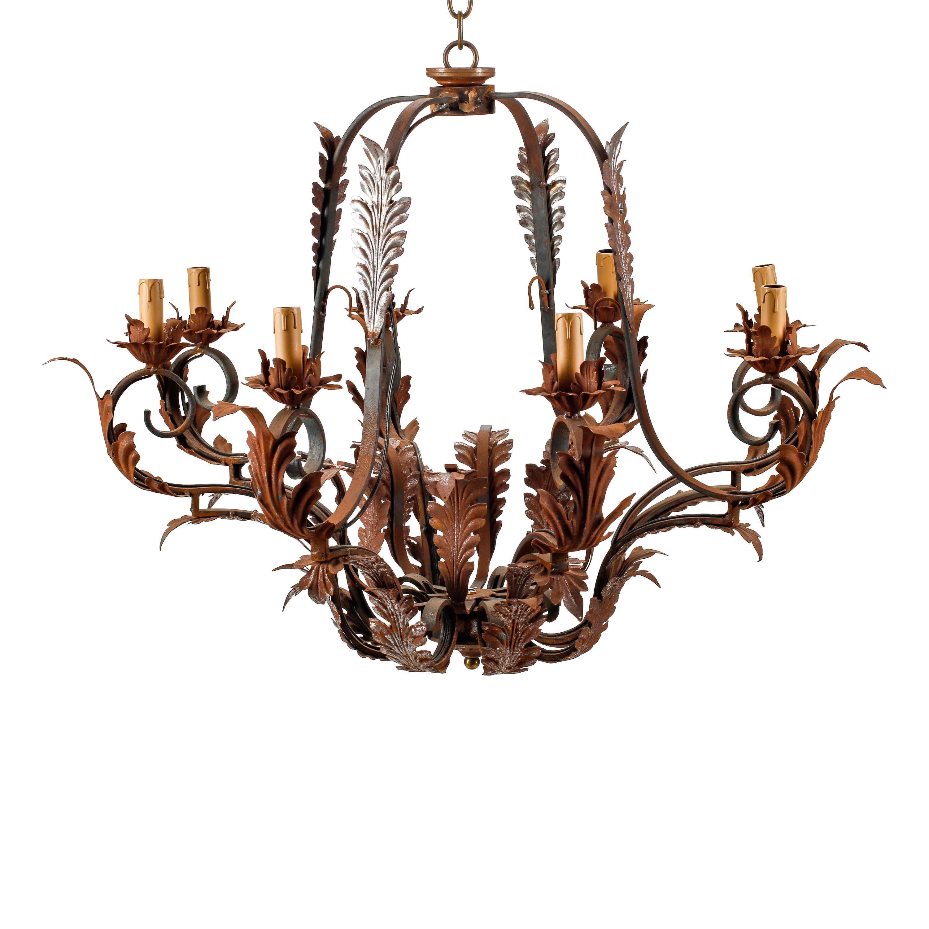 A Pair of Spanish Iron and Tole Eight-Light Chandeliers