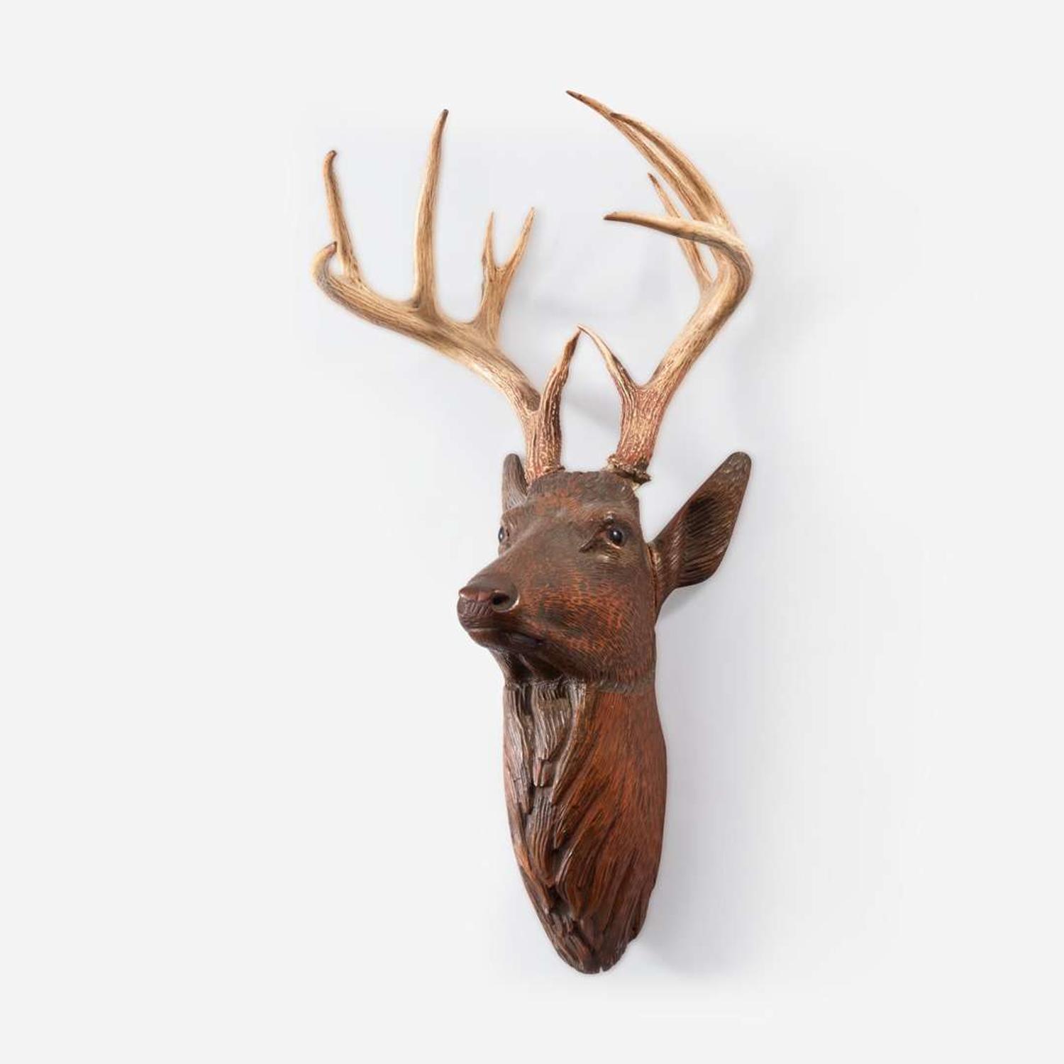 A Swiss Black Forest Carved Wood Stags Head late 19th/early 20th century