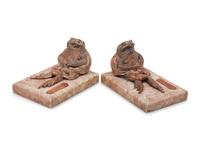 A Pair of Silvered Copper and Marble Bookends