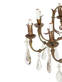 A Pierced Brass Eight-Light Chandelier with Crystal Drops