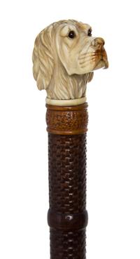 A Carved Wood Cane, Length of handle 2 x length overall 32 inches.