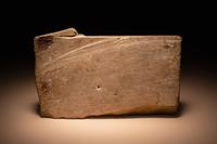 A Maya Limestone Panel with Glyphs