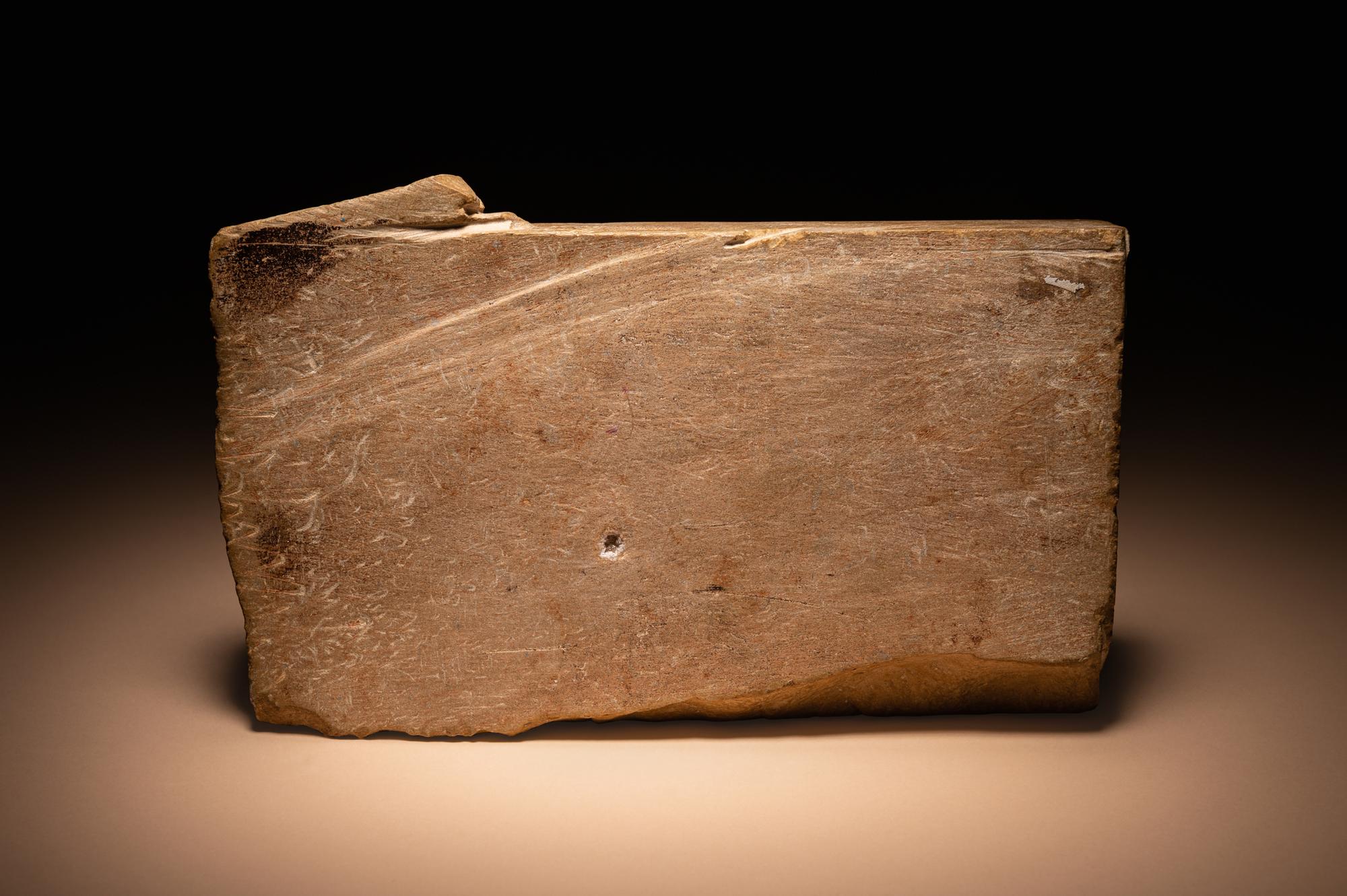A Maya Limestone Panel with Glyphs