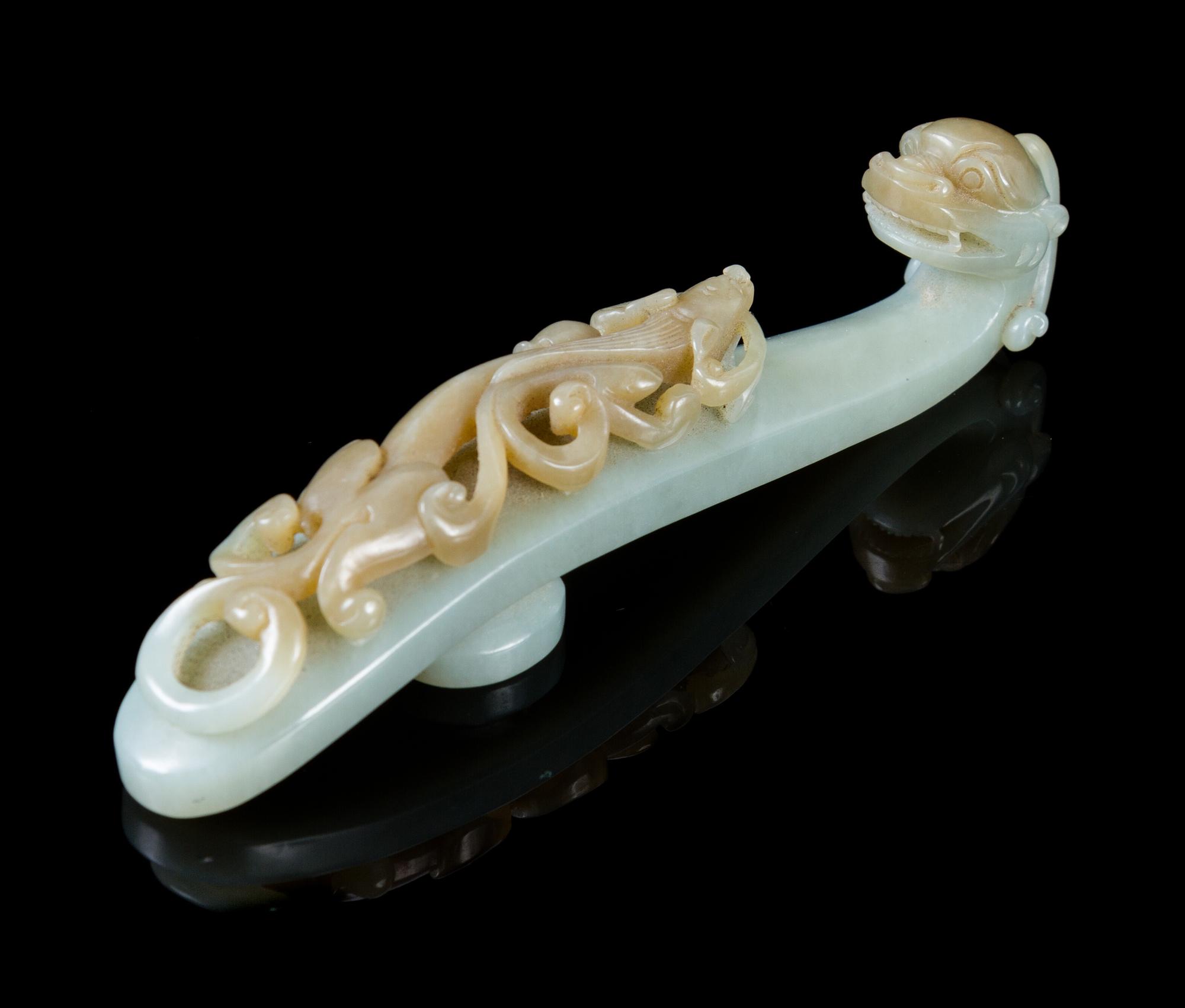 A Carved Greyish Celadon Jade Belt Hook Length 4 7/8 inches.