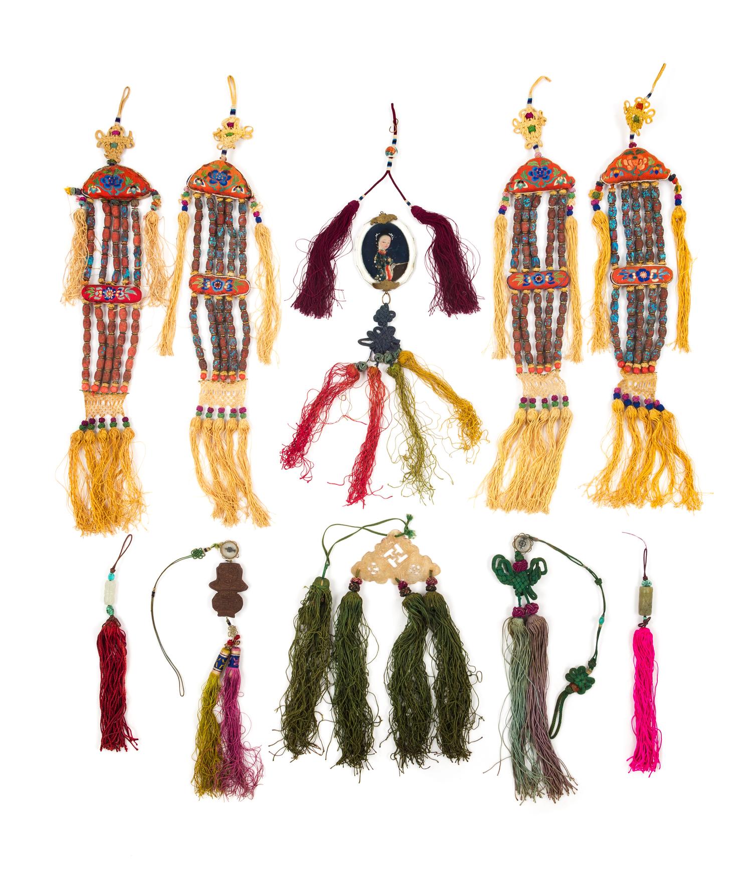 Eleven Chinese Hardstone and Silk Pendants Length of longest 16 inches.