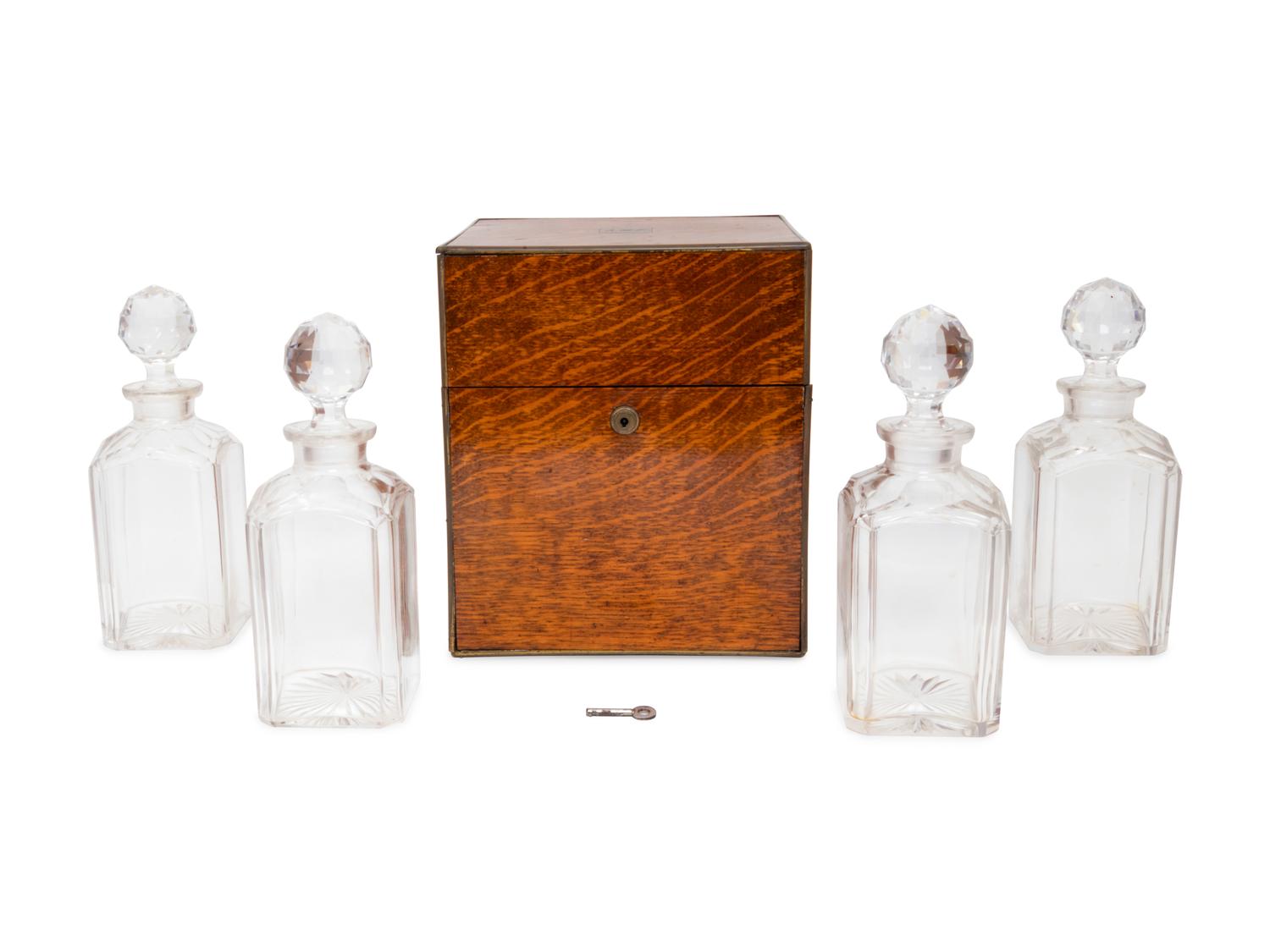 An English Oak Cased Cut Glass Decanter Set