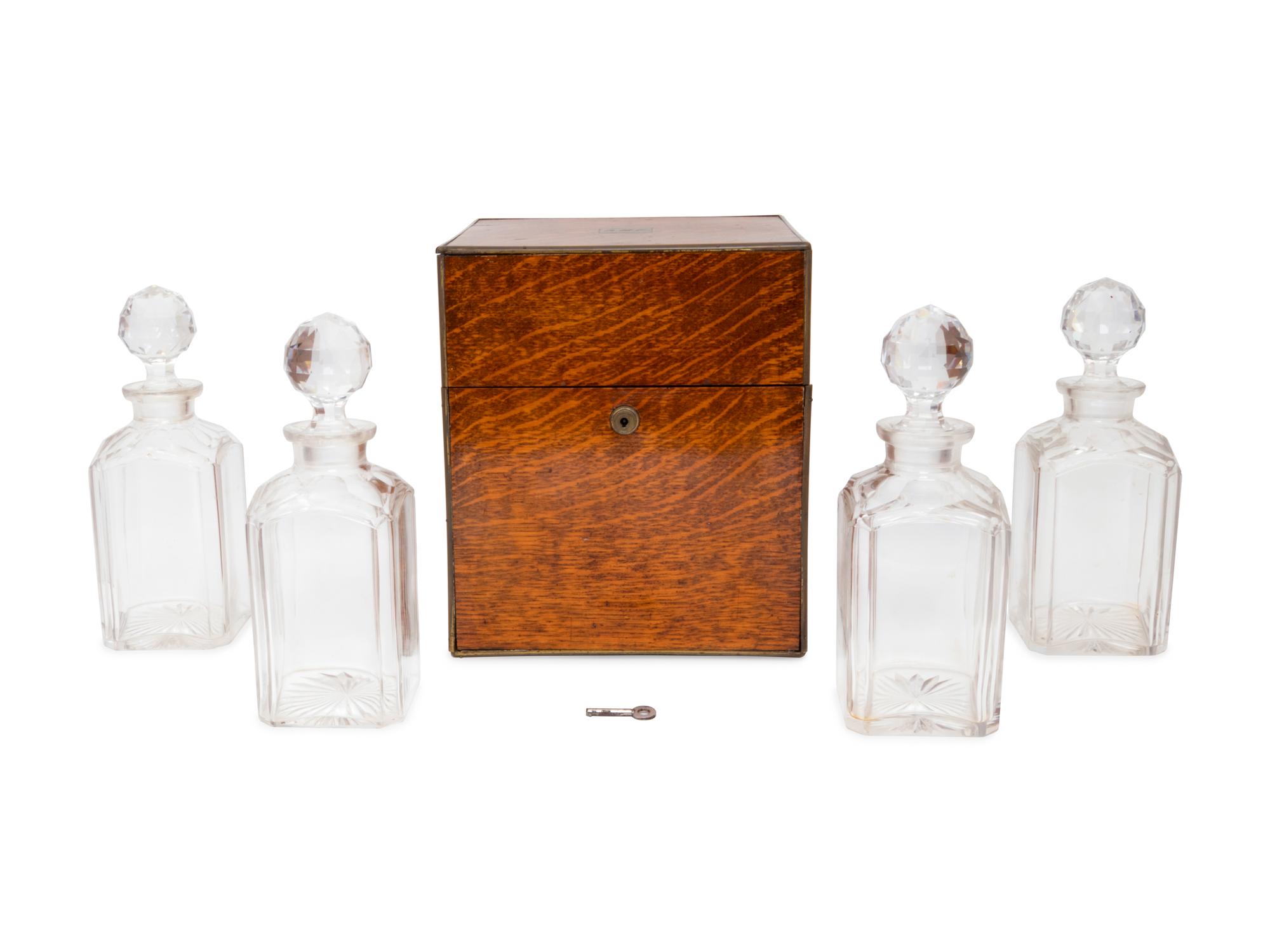 An English Oak Cased Cut Glass Decanter Set