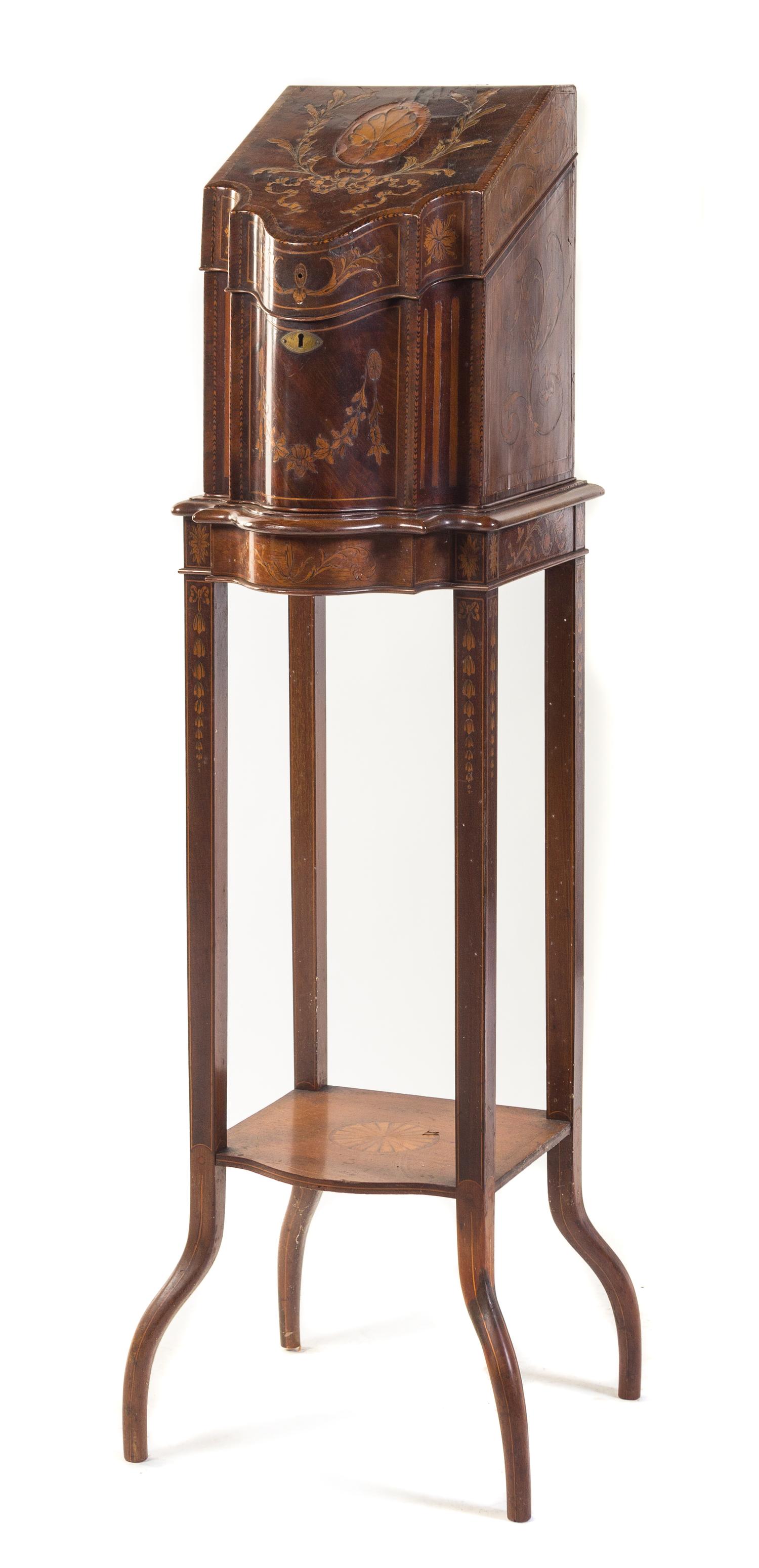 An Edwardian Marquetry Mahogany Letter Box and Stand Height overall 49 1/2 inches.