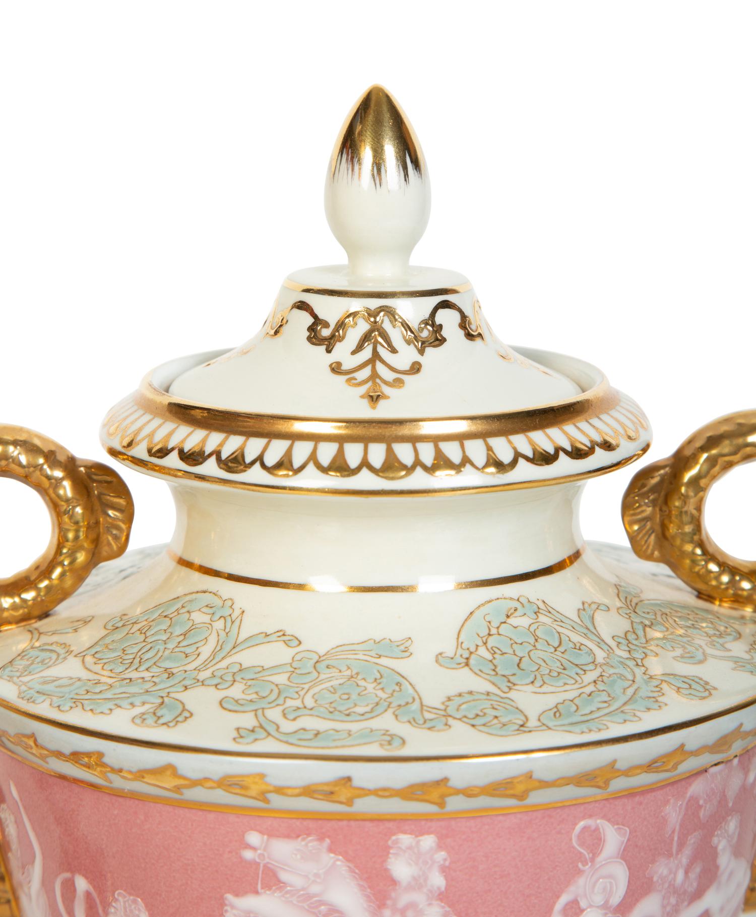A Pair of Pâte-sur-Pâte Style Porcelain Urns with Gilt Dolphin Handles