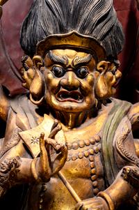 A Large Gilt and Red Lacquered Wood Figure of Mahakala