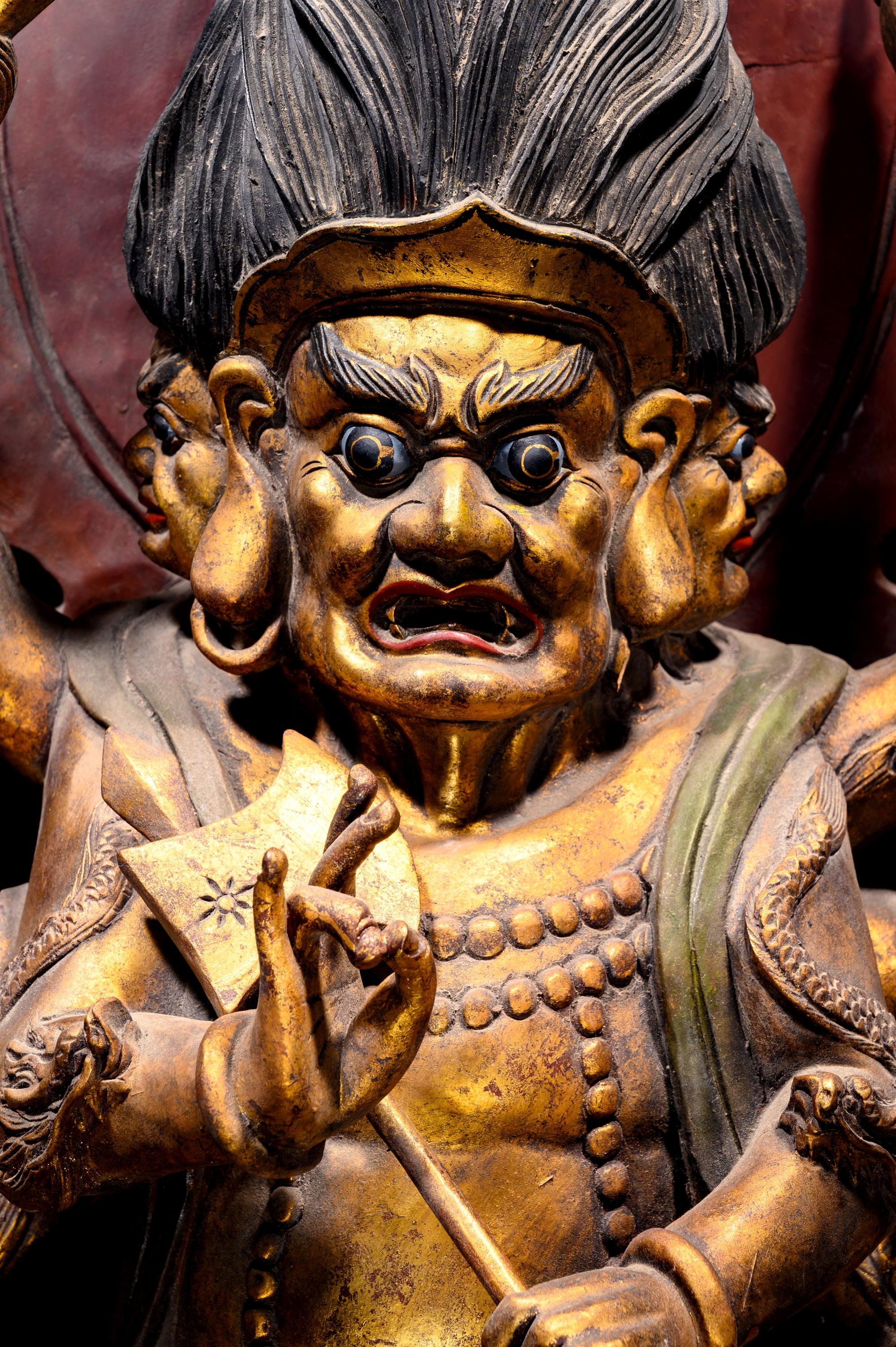 A Large Gilt and Red Lacquered Wood Figure of Mahakala