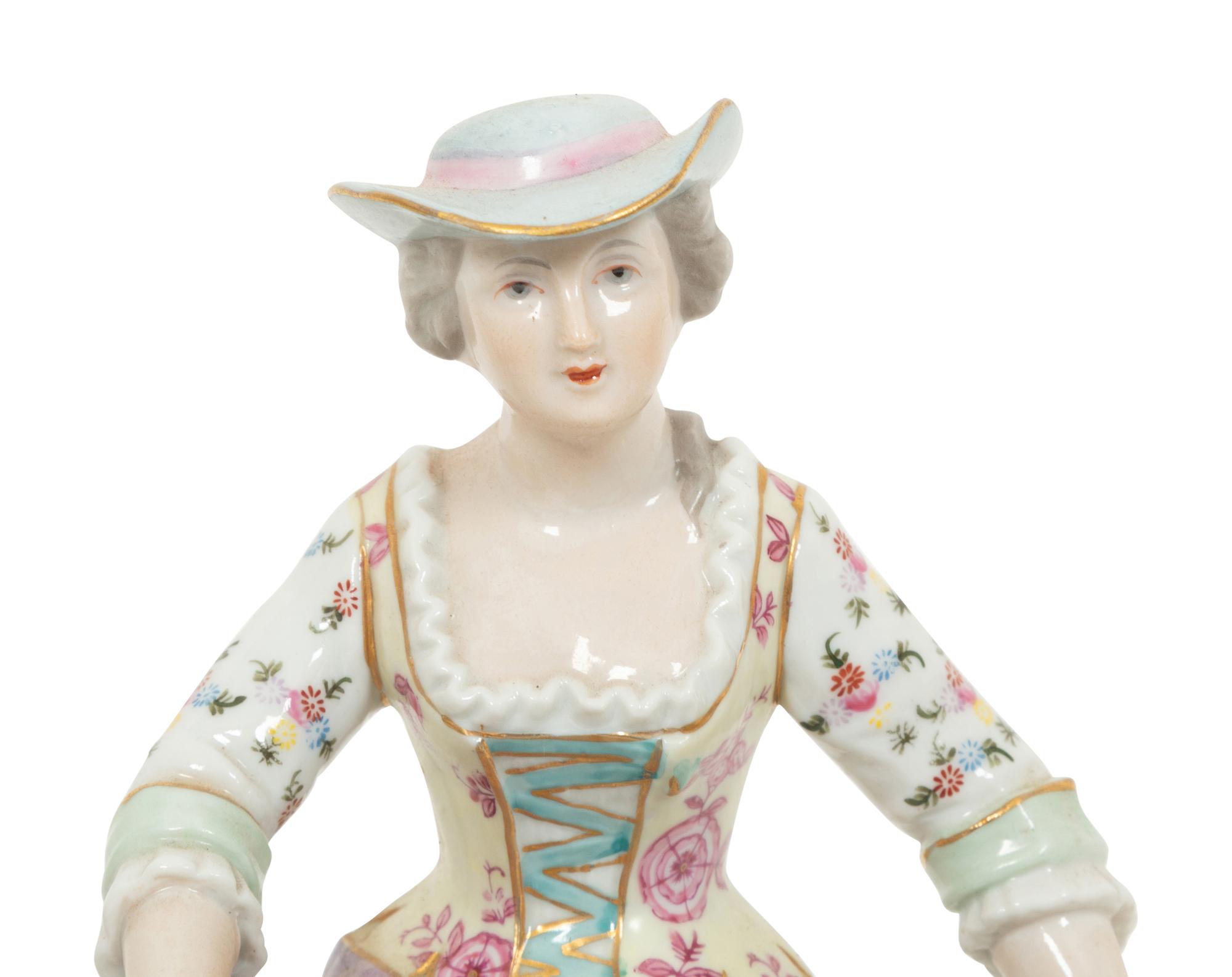 A Pair of Dresden Porcelain Figural Sweetmeat Dishes