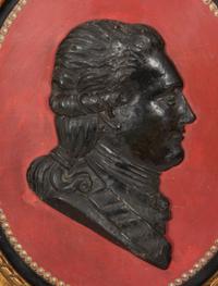 A Pair of Giltwood Framed Ebonized Relief Portrait Plaques of French Nobility, 18th Century